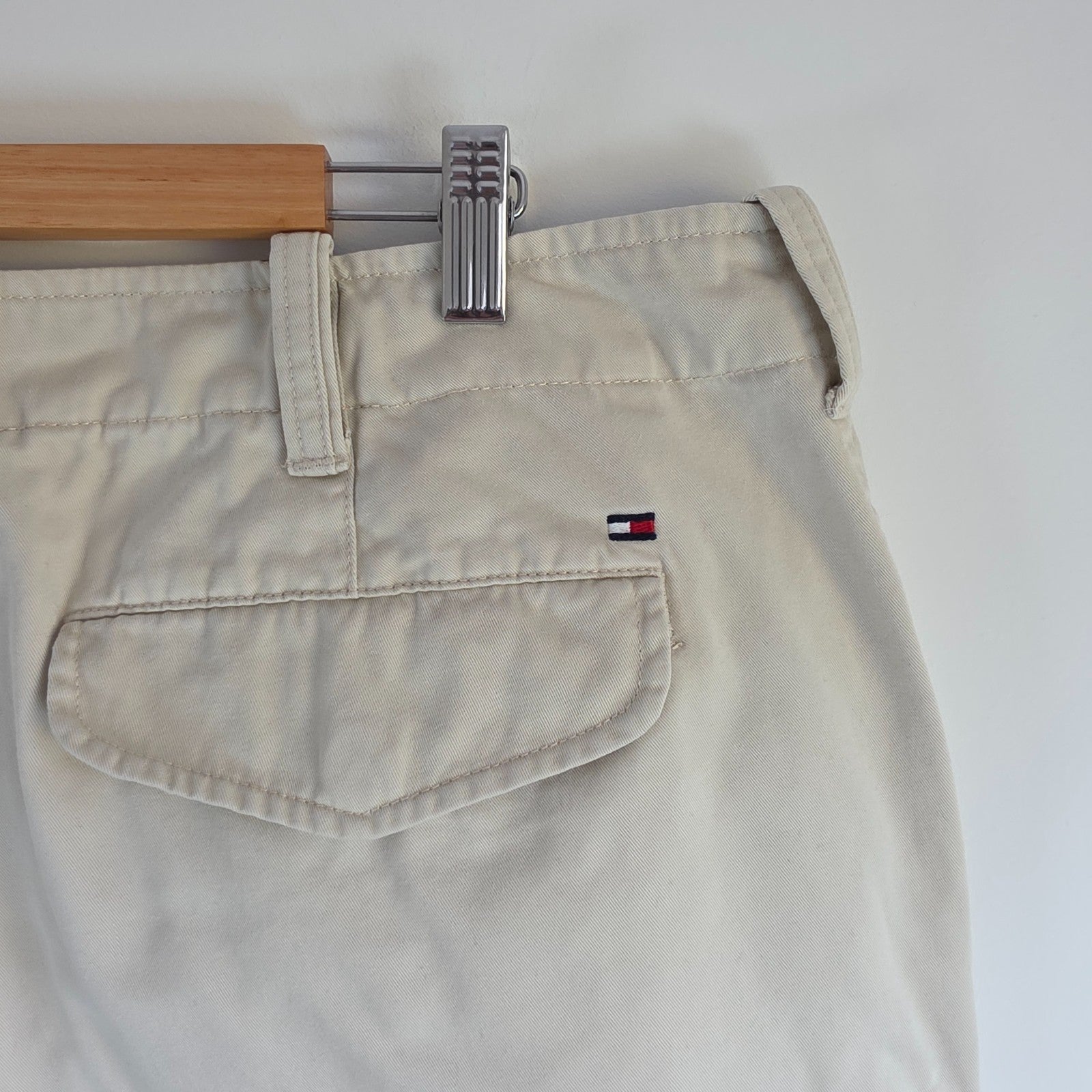 Tommy Hilfiger beige cargo shorts with utility pockets and cotton material.