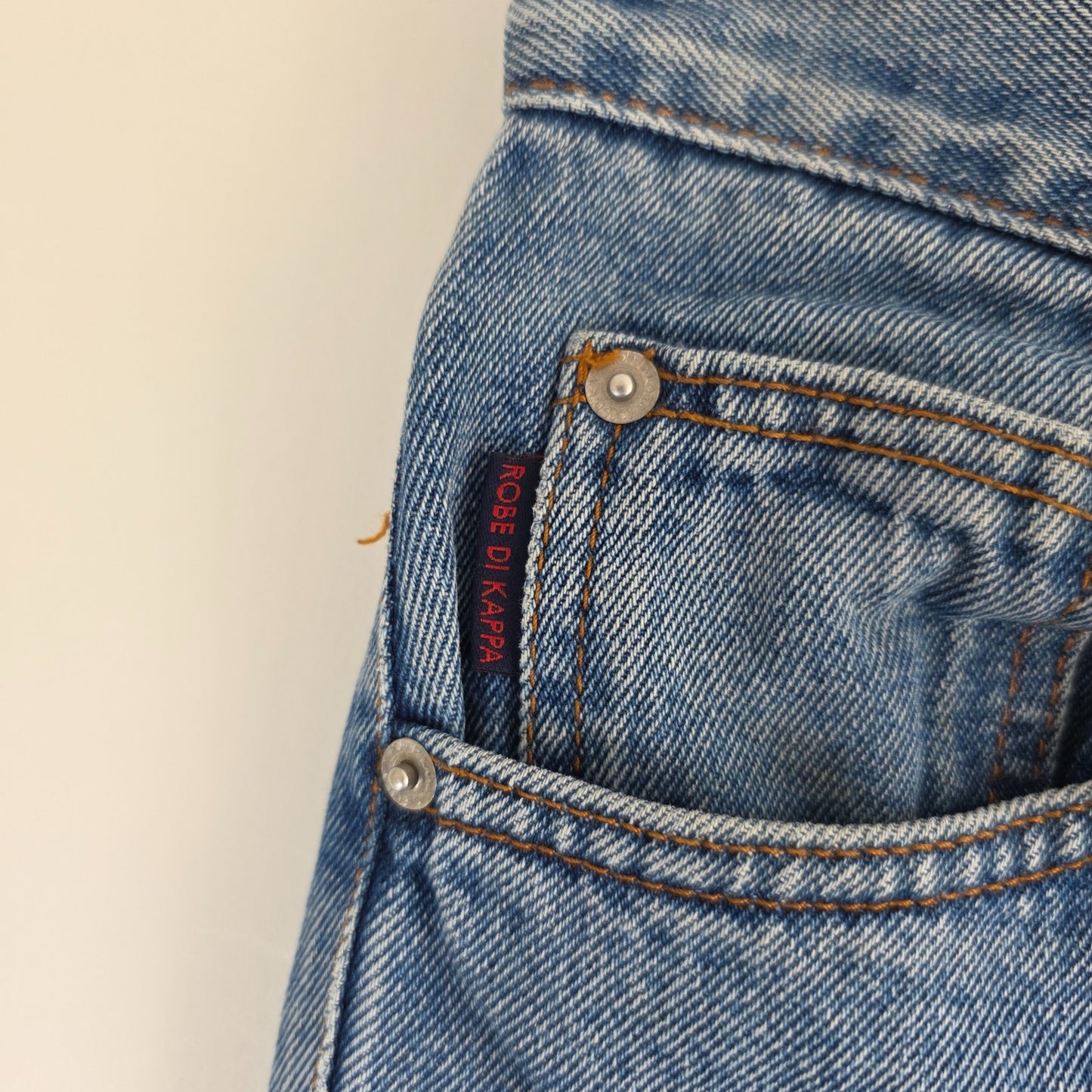 Robe Di Kappa blue straight jeans with vintage wash and subtle logo detail.