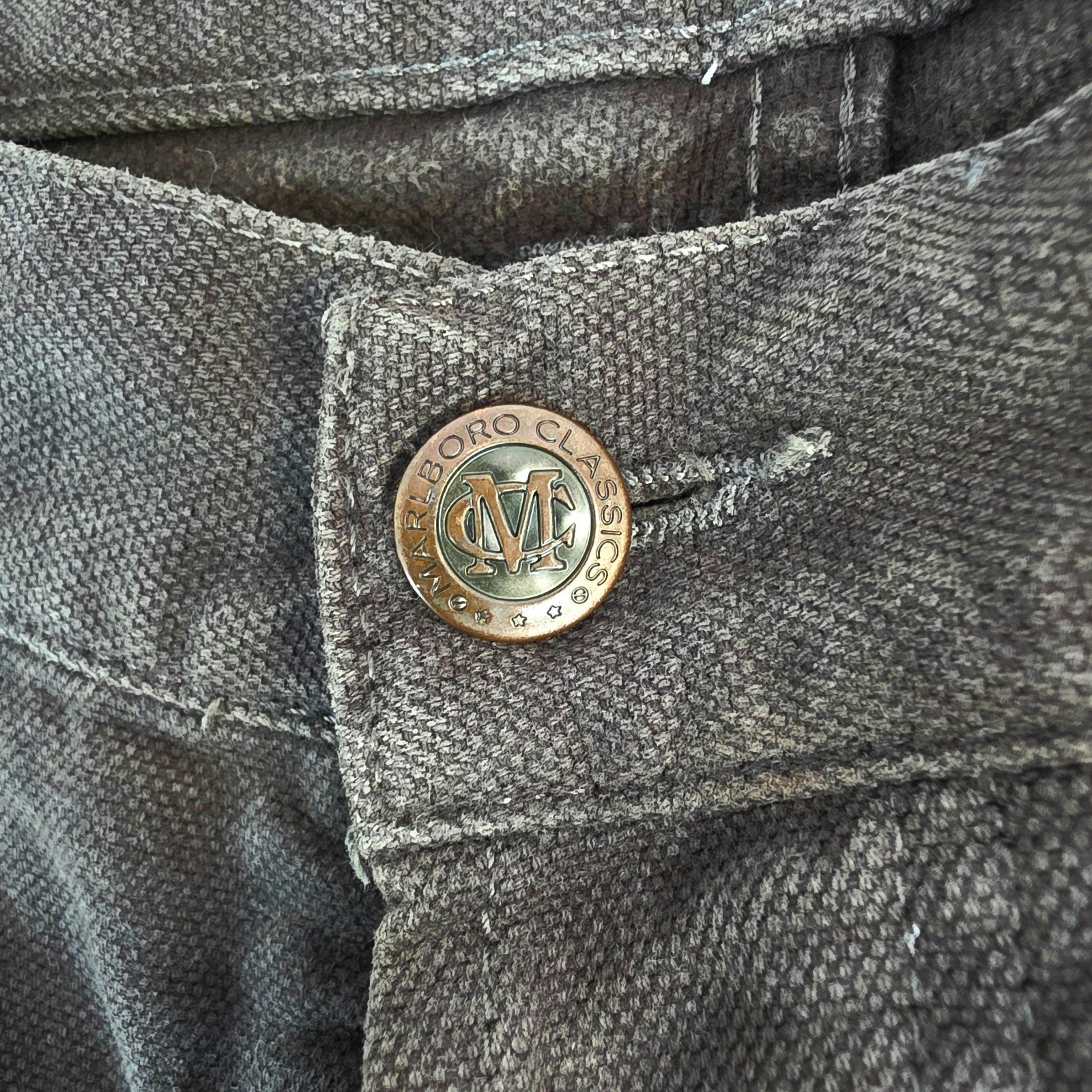 Marlboro Classics grey straight jeans with button fly and vintage logo detail.