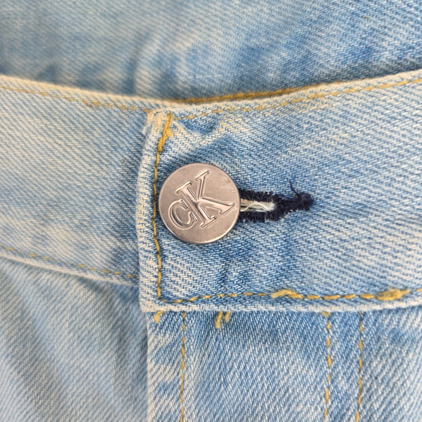 Calvin Klein light blue straight jeans, 100% cotton, classic five-pocket design.