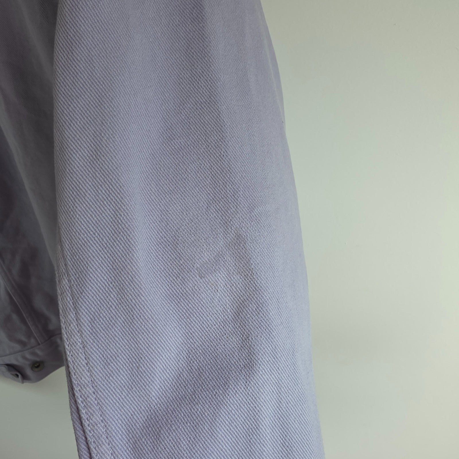 Albam lilac denim jacket with button front, chest pockets, and side pockets.