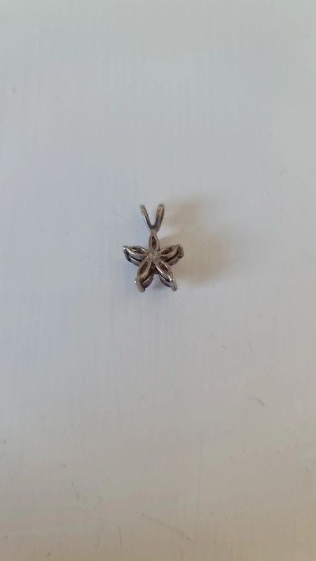 Sterling Silver Flower Pendant with Purple Stones