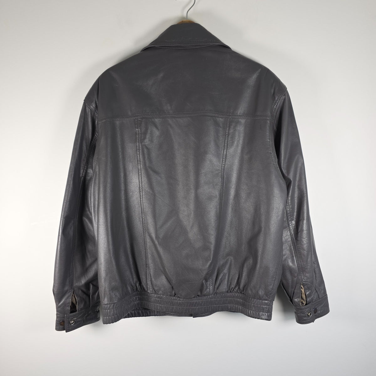 St Michael grey leather bomber jacket with utility pockets and elasticated waistband.