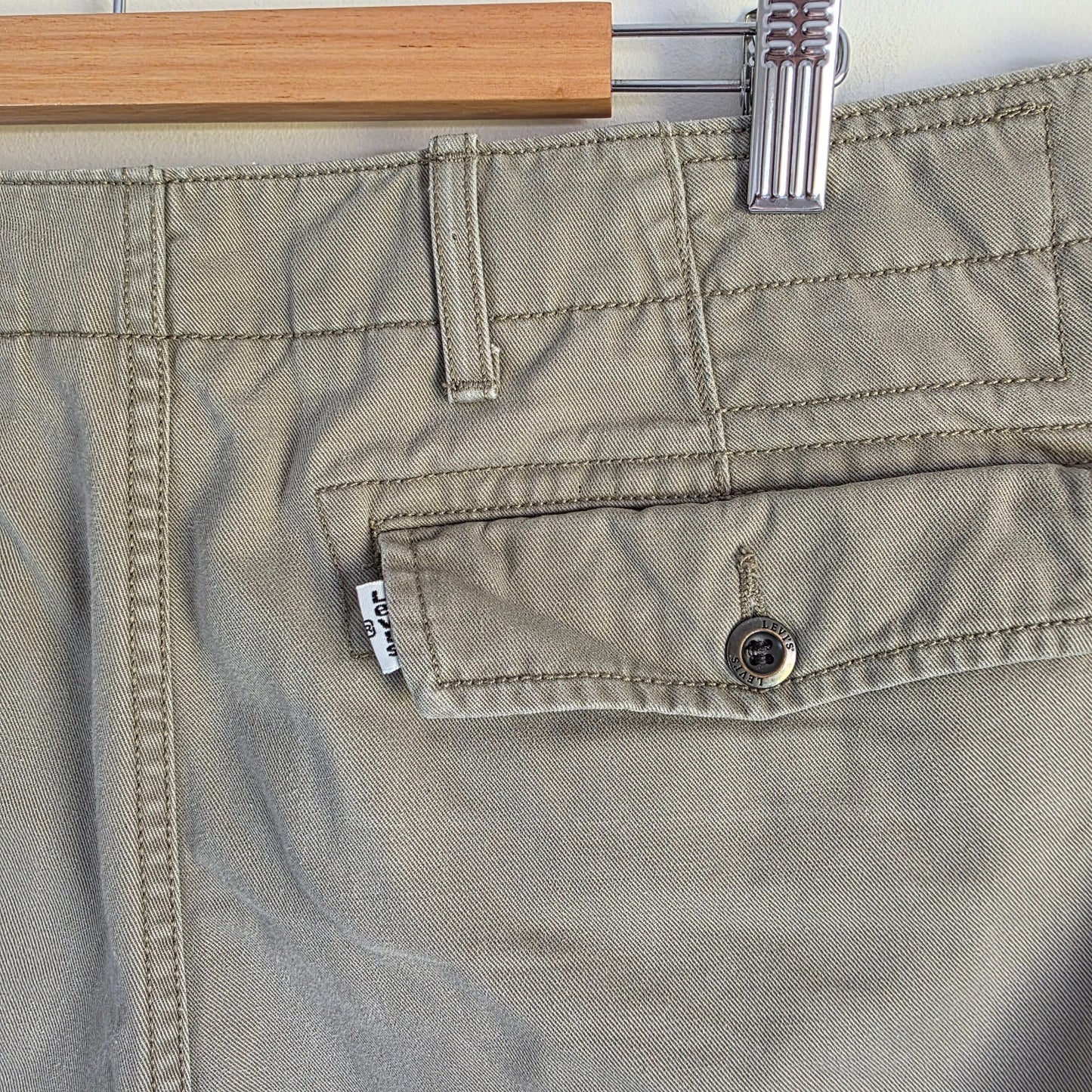 Levi's beige cargo shorts with utility pockets and cotton material, very good condition.