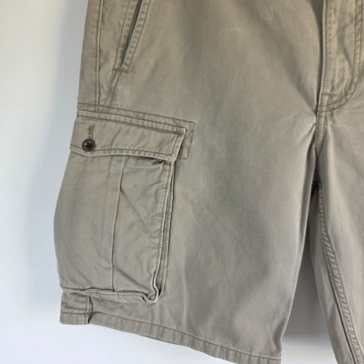 Levi's beige cargo shorts with utility pockets and cotton material, very good condition.