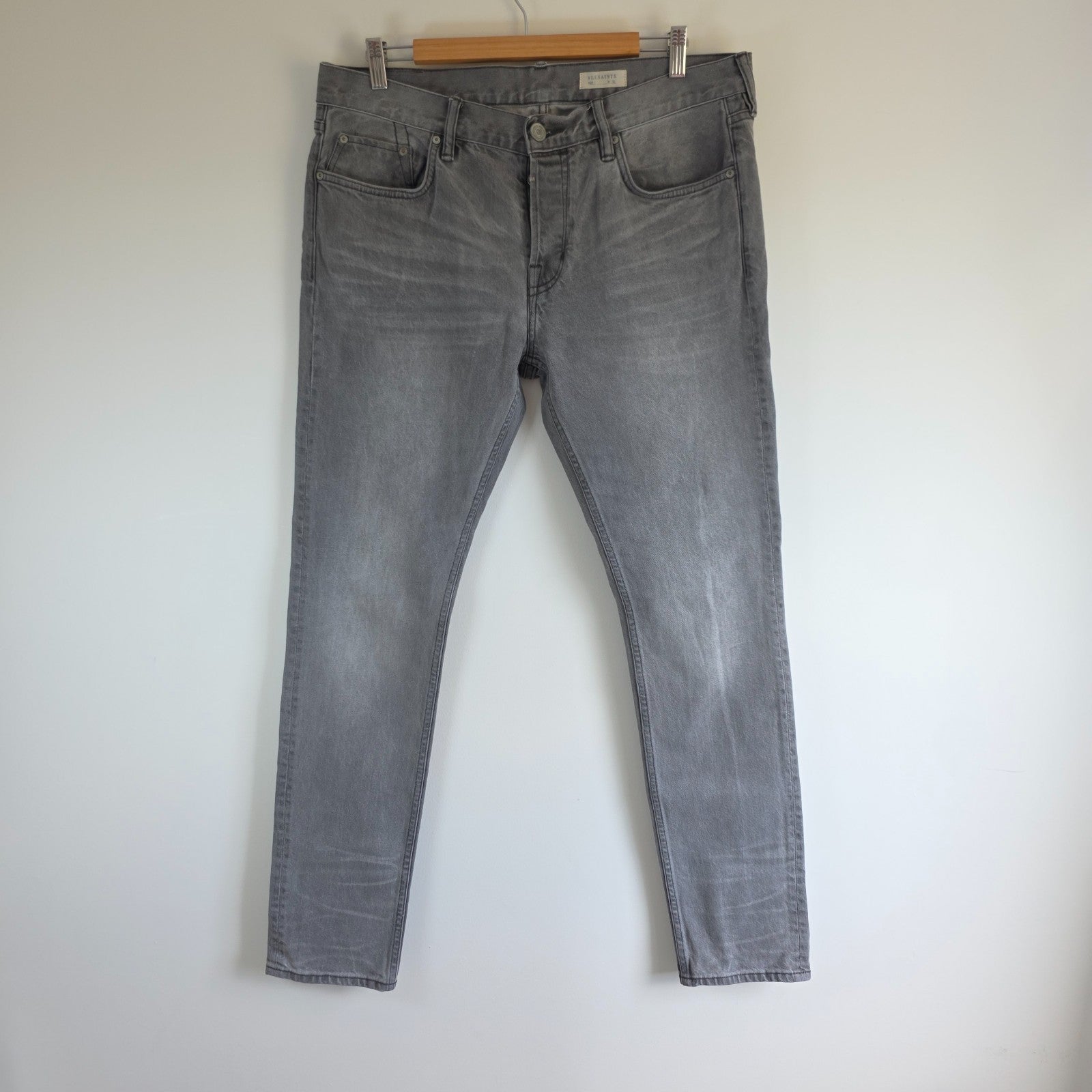 AllSaints grey slim jeans with button fly and stretch cotton elastane blend.