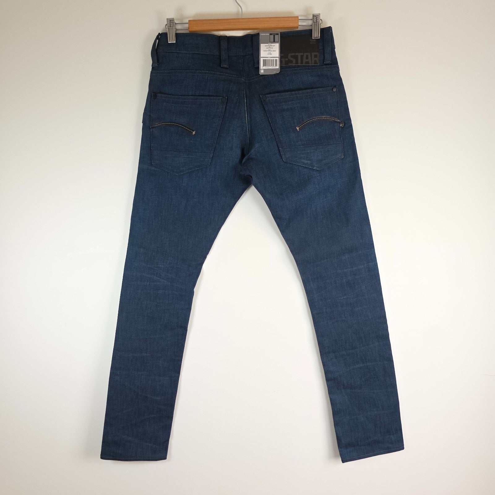 G-Star blue straight jeans with button fly and BNWT tag, cotton elastane blend.