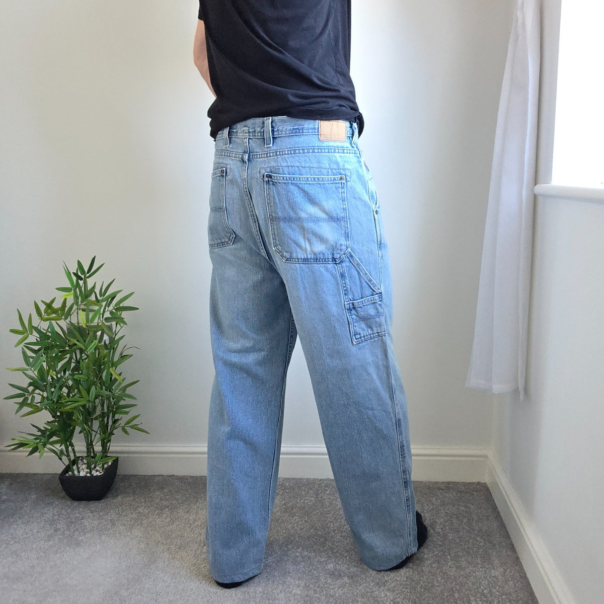 Urban Up blue carpenter jeans with hammer loop and utility pocket detailing.