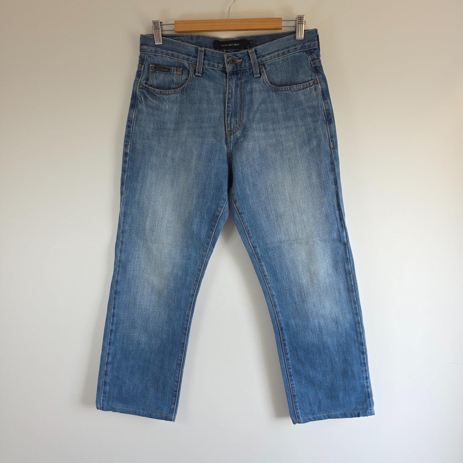 Calvin Klein blue straight jeans 100% cotton with relaxed fit and subtle logo detail.