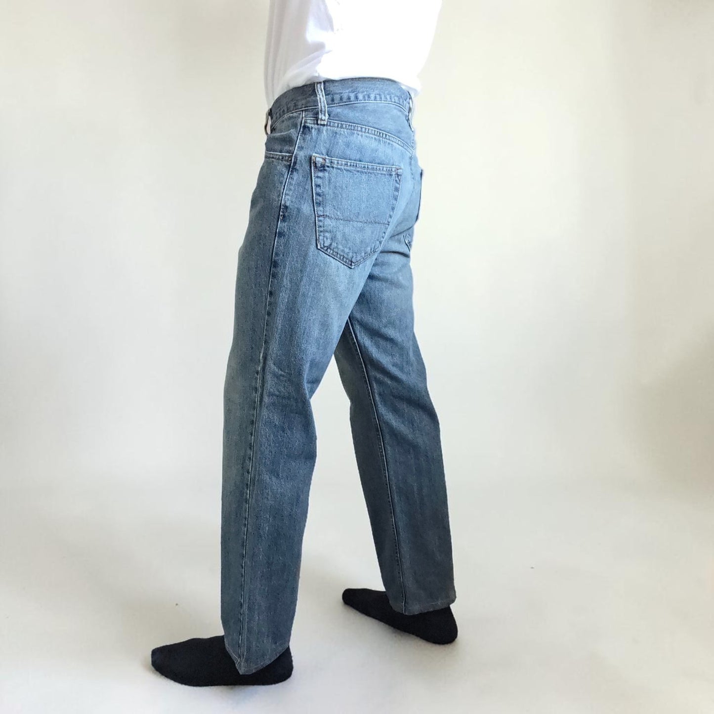 Levi's blue straight leg jeans, cotton material, missing back waist patch, casual style.