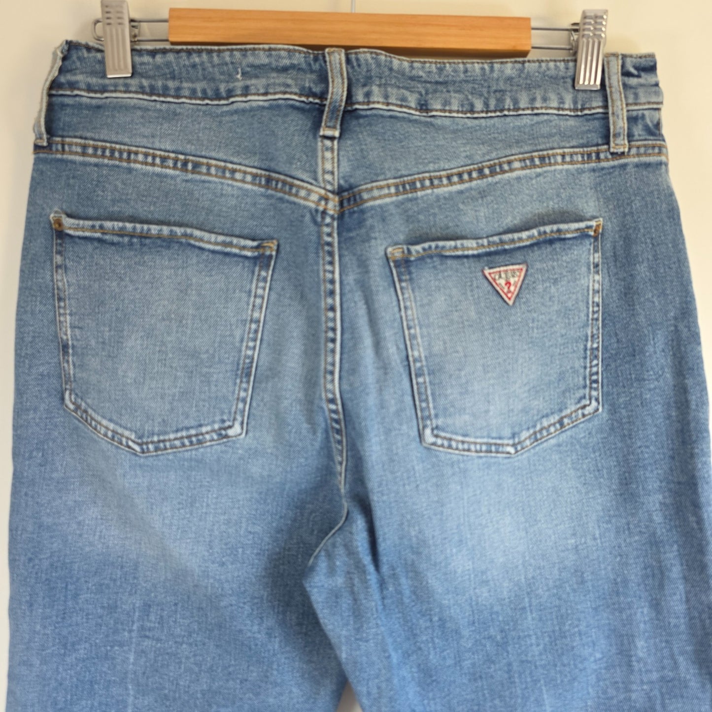 Vintage Guess blue cropped straight jeans with distressed details and high rise fit.