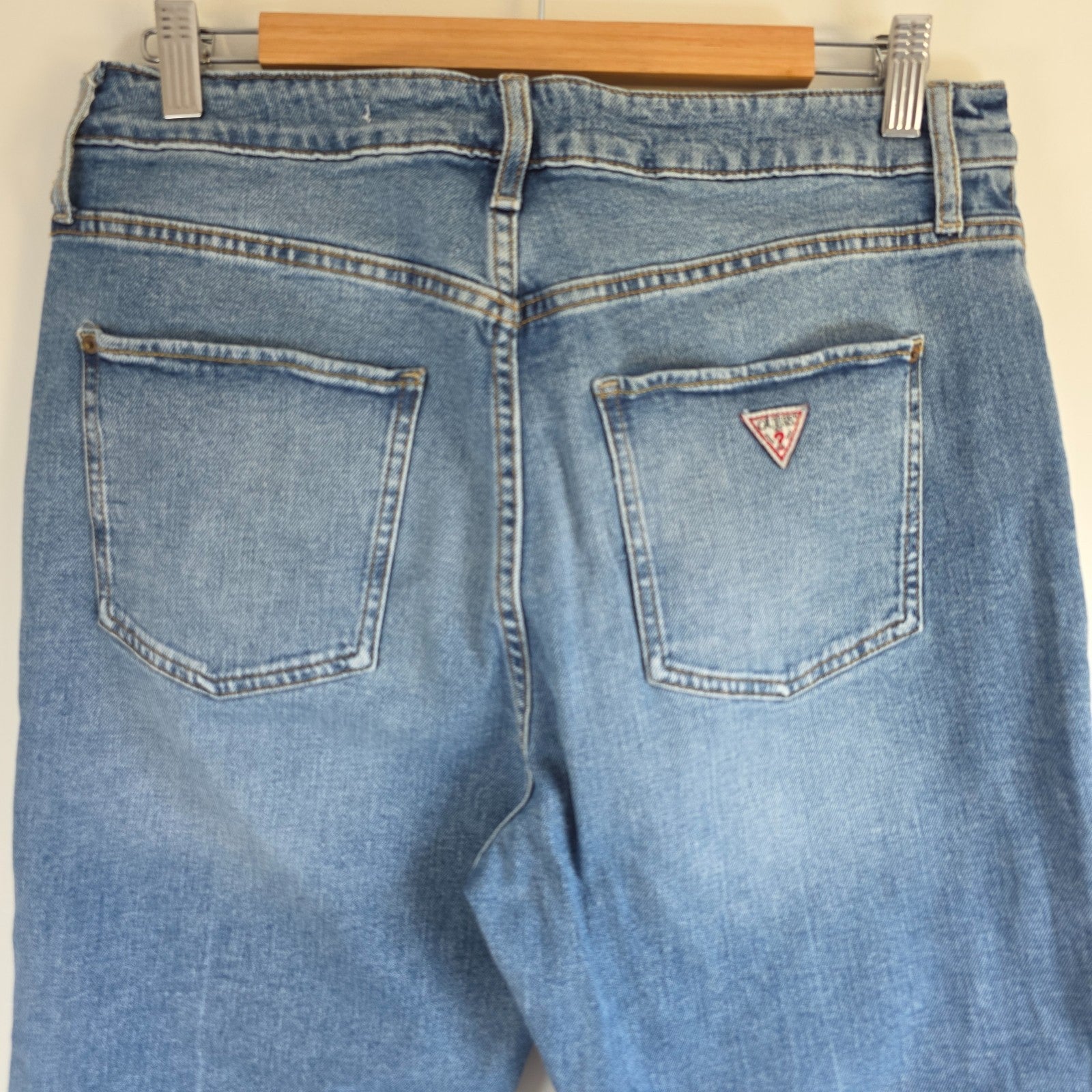 Vintage Guess blue cropped straight jeans with distressed details and high rise fit.