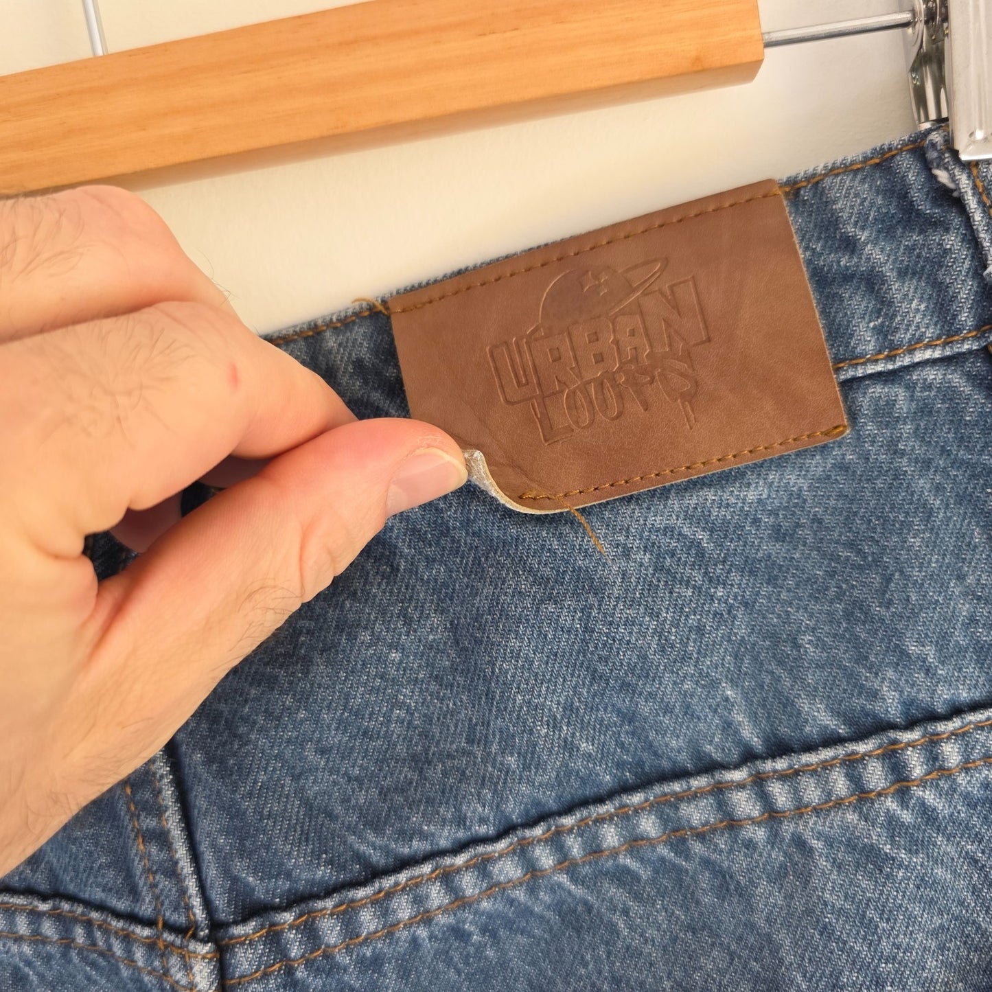 Wrangler blue baggy carpenter jeans with embroidered back pocket design and carpenter pocket detailing.