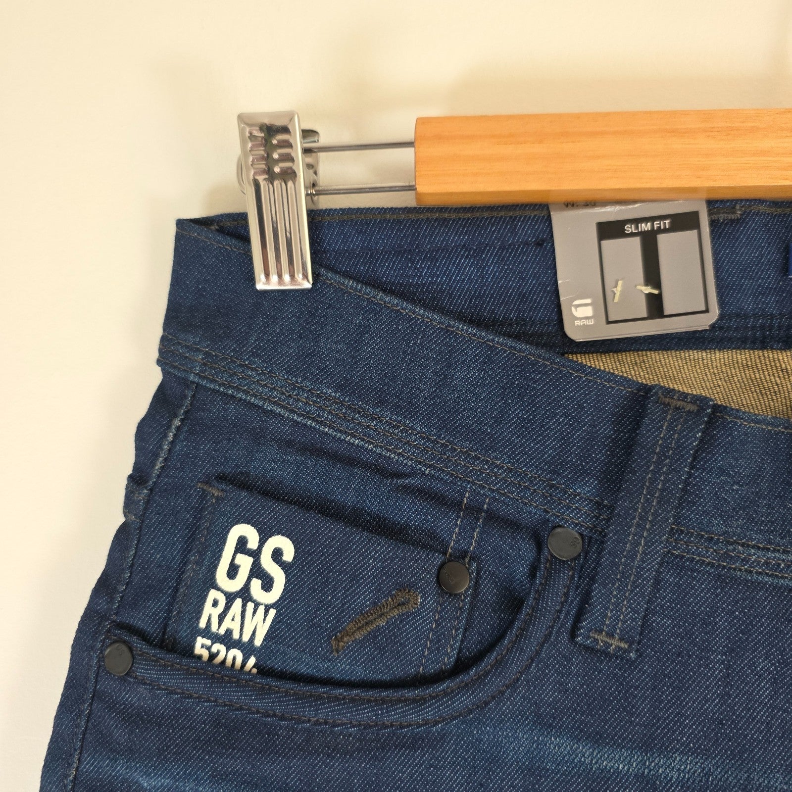 G-Star blue straight jeans with button fly and BNWT tag, cotton elastane blend.
