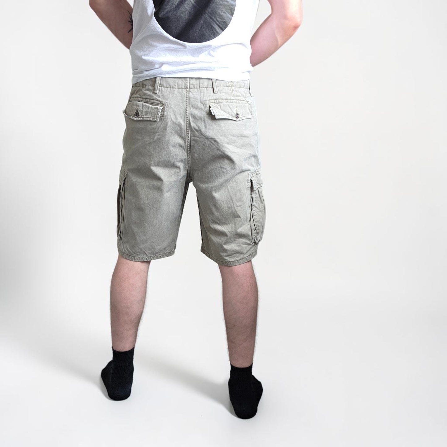 Levi's beige cargo shorts with utility pockets and cotton material, very good condition.