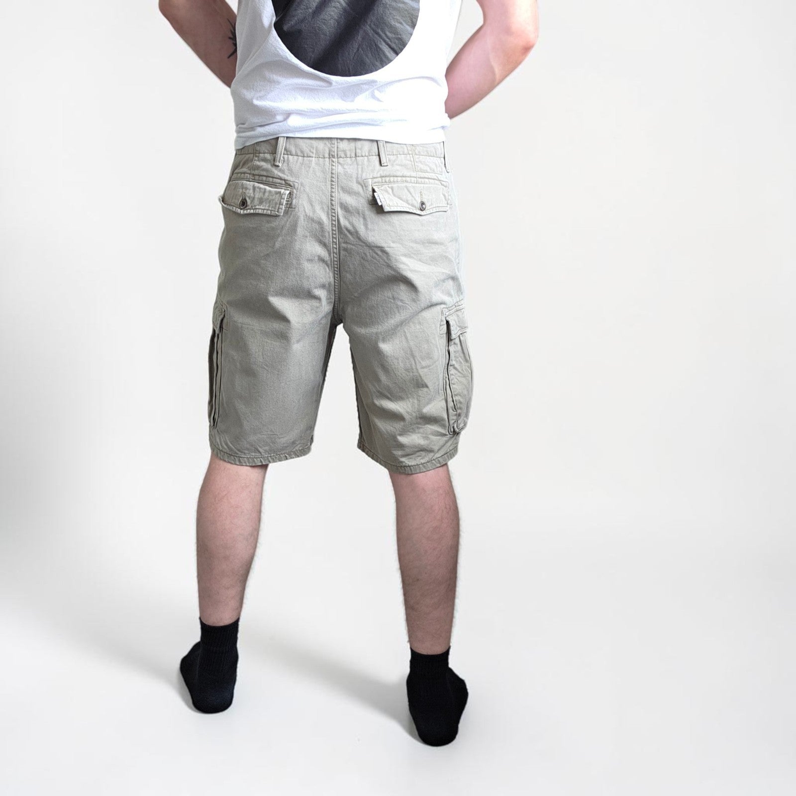 Levi's beige cargo shorts with utility pockets and cotton material, very good condition.