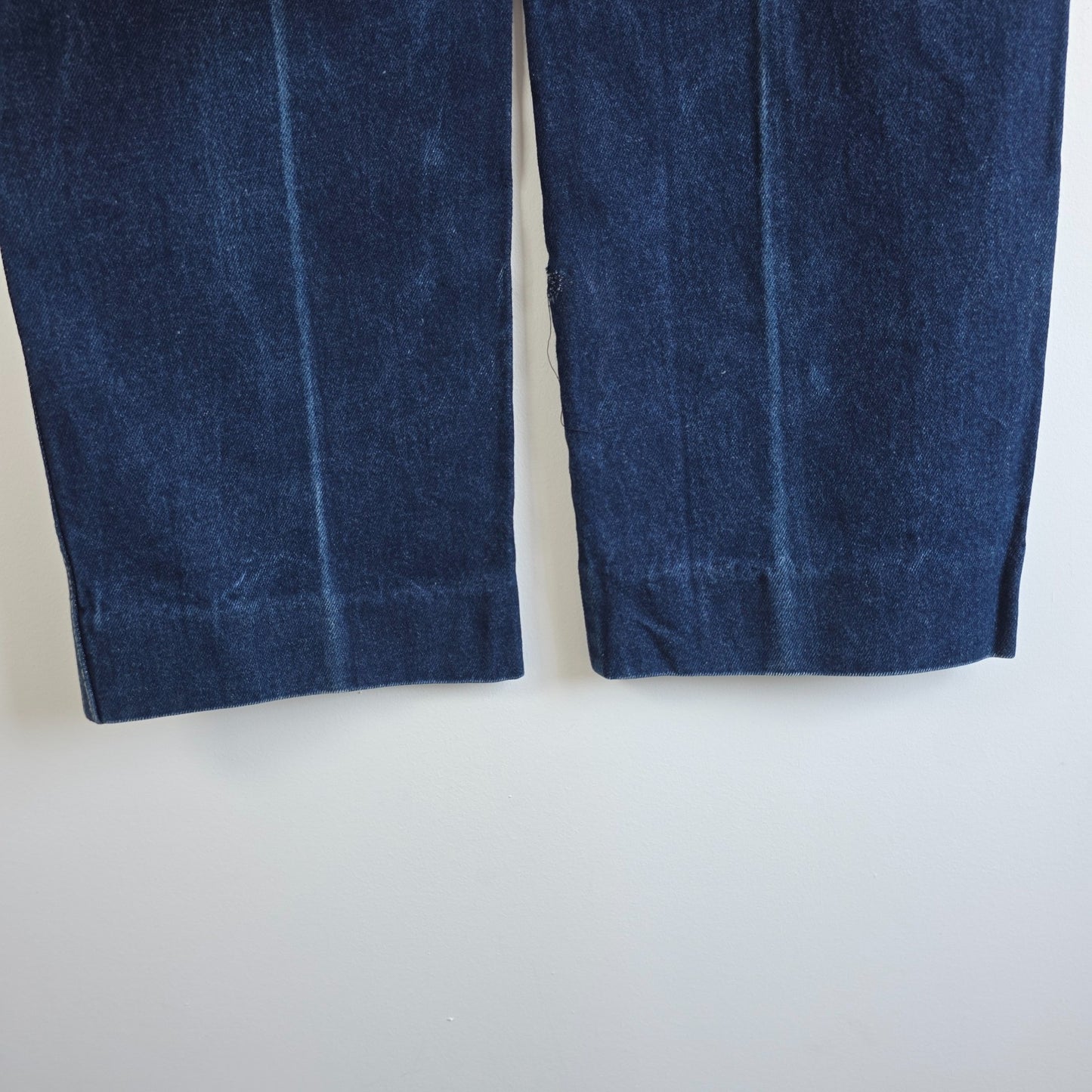 Calvin Klein blue straight leg jeans with vintage 90s style and cotton material.