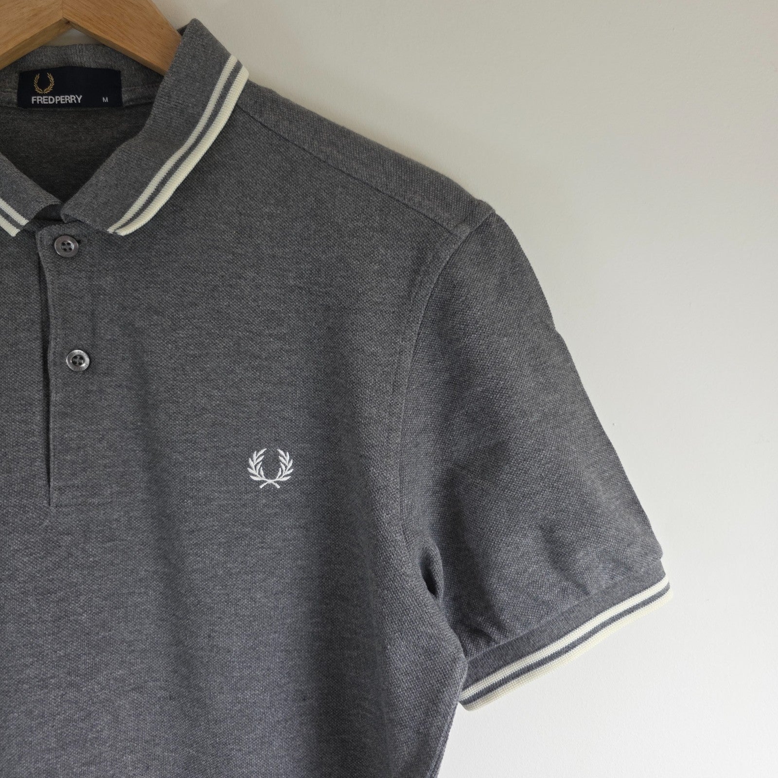 Fred Perry grey polo shirt with white twin tipping and classic laurel logo.