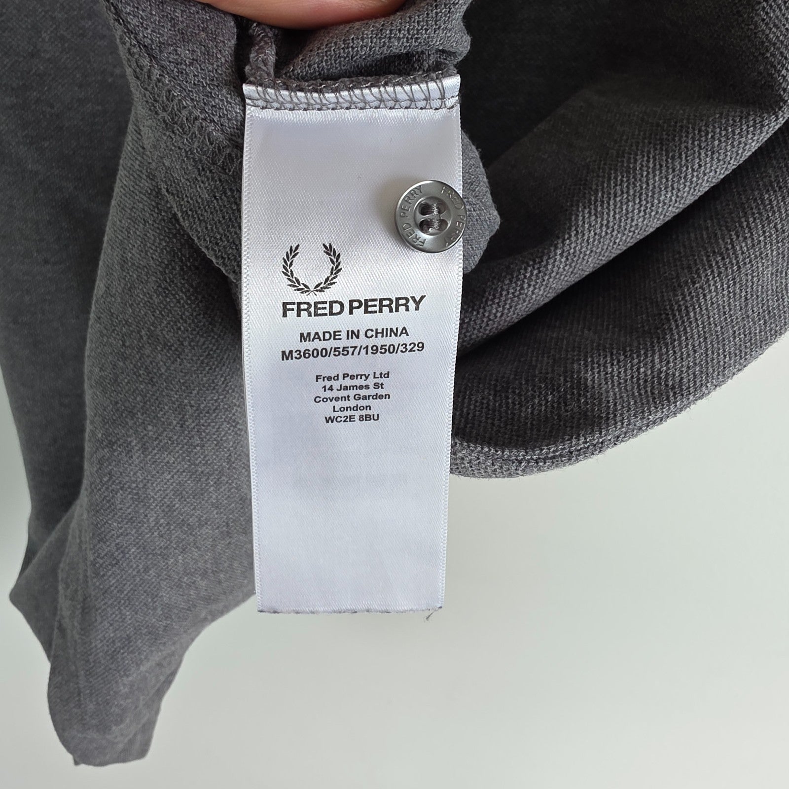 Fred Perry grey polo shirt with white twin tipping and classic laurel logo.
