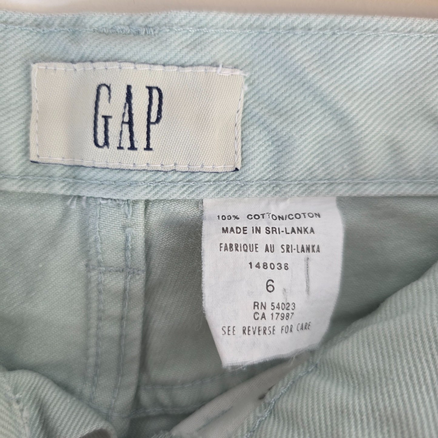 Gap pale mint green straight leg jeans with high rise and 100% cotton material.