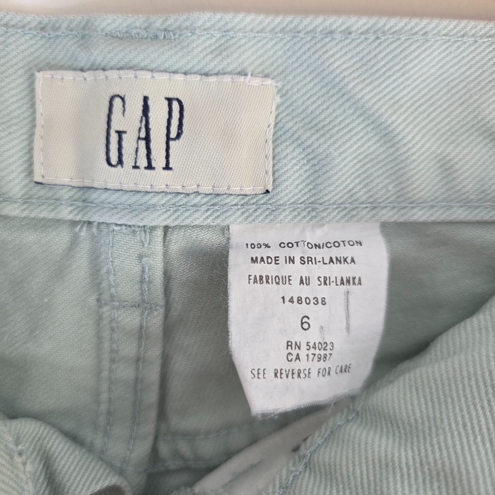 Gap pale mint green straight leg jeans with high rise and 100% cotton material.