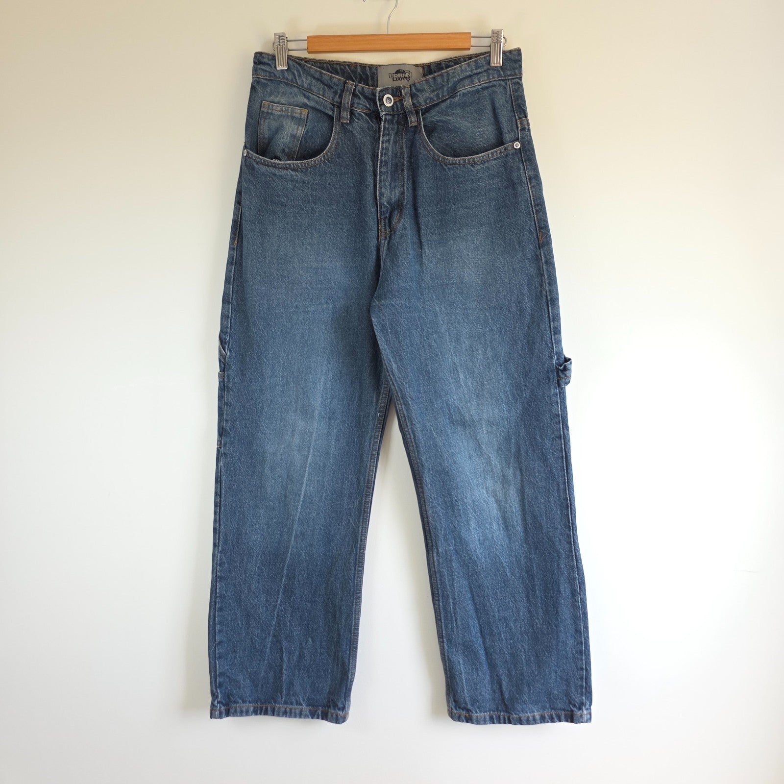 Wrangler blue baggy carpenter jeans with embroidered back pocket design and carpenter pocket detailing.