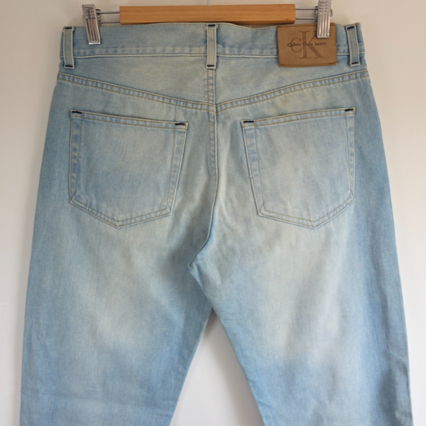 Calvin Klein light blue straight jeans, 100% cotton, classic five-pocket design.