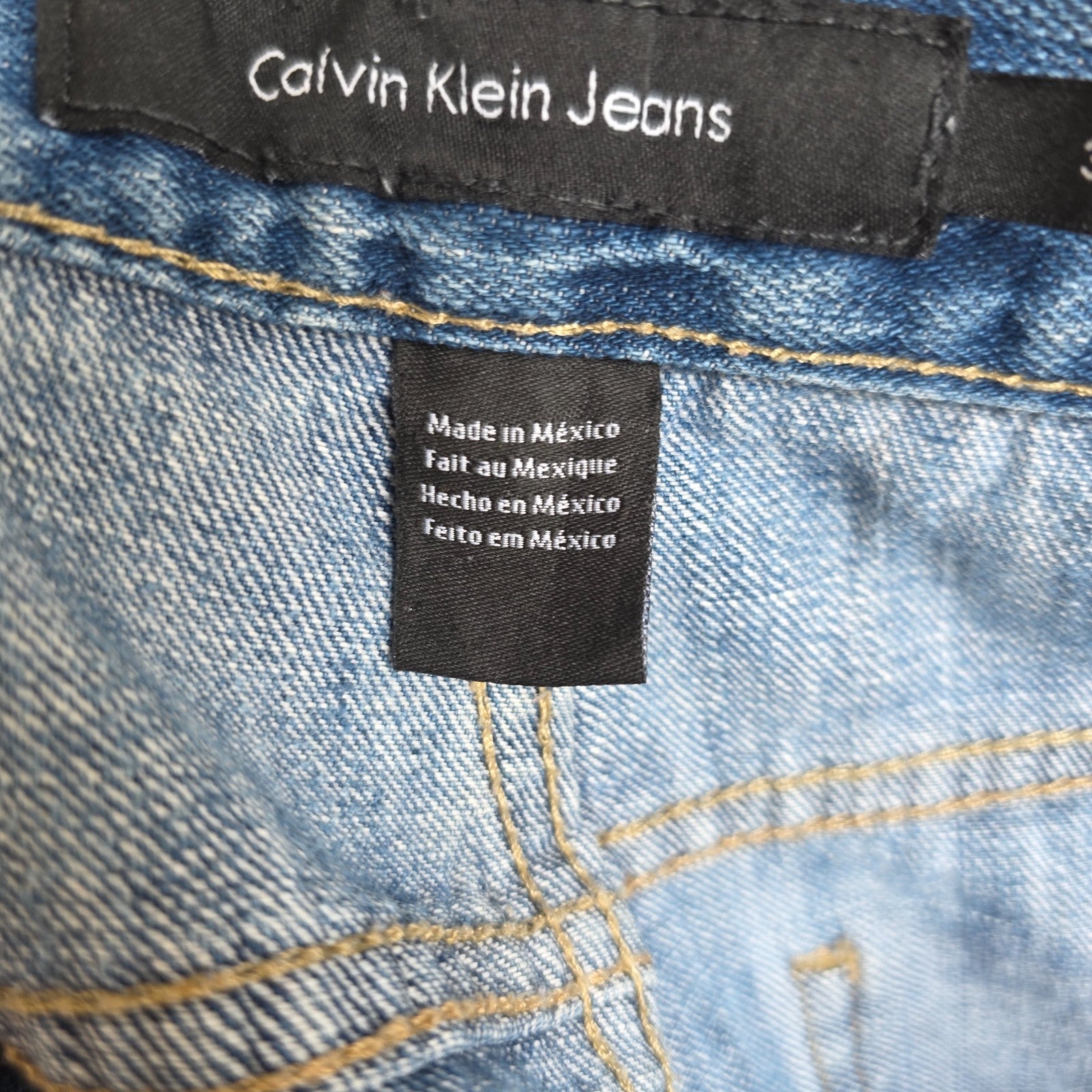 Calvin Klein blue straight jeans 100% cotton with relaxed fit and subtle logo detail.