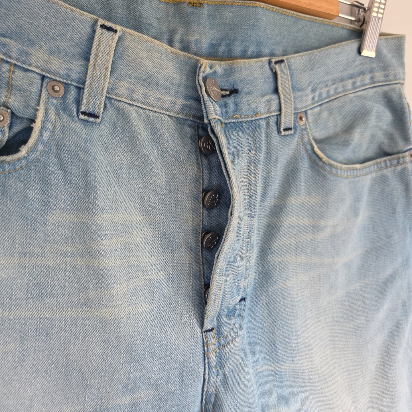 Calvin Klein light blue straight jeans, 100% cotton, classic five-pocket design.