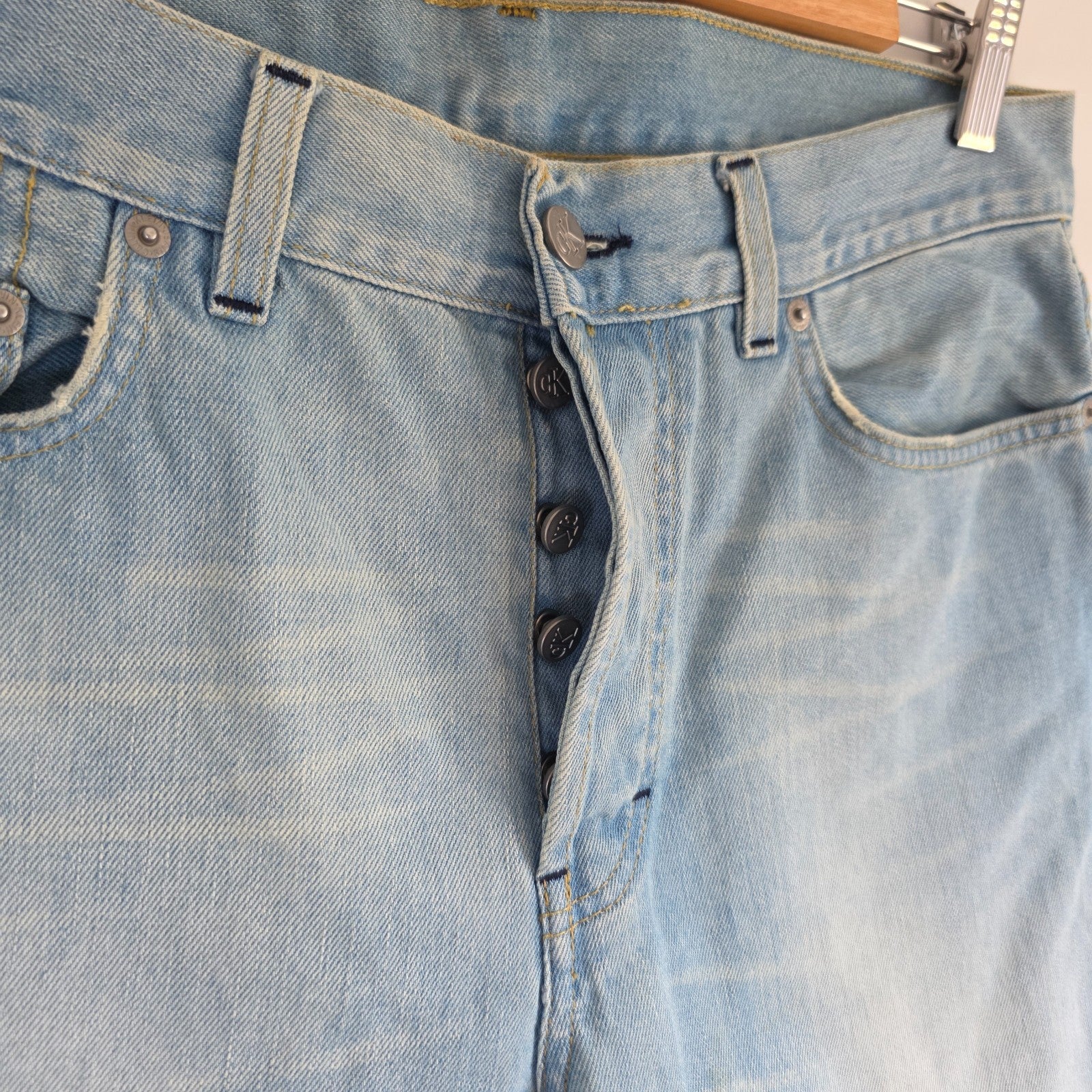 Calvin Klein light blue straight jeans, 100% cotton, classic five-pocket design.