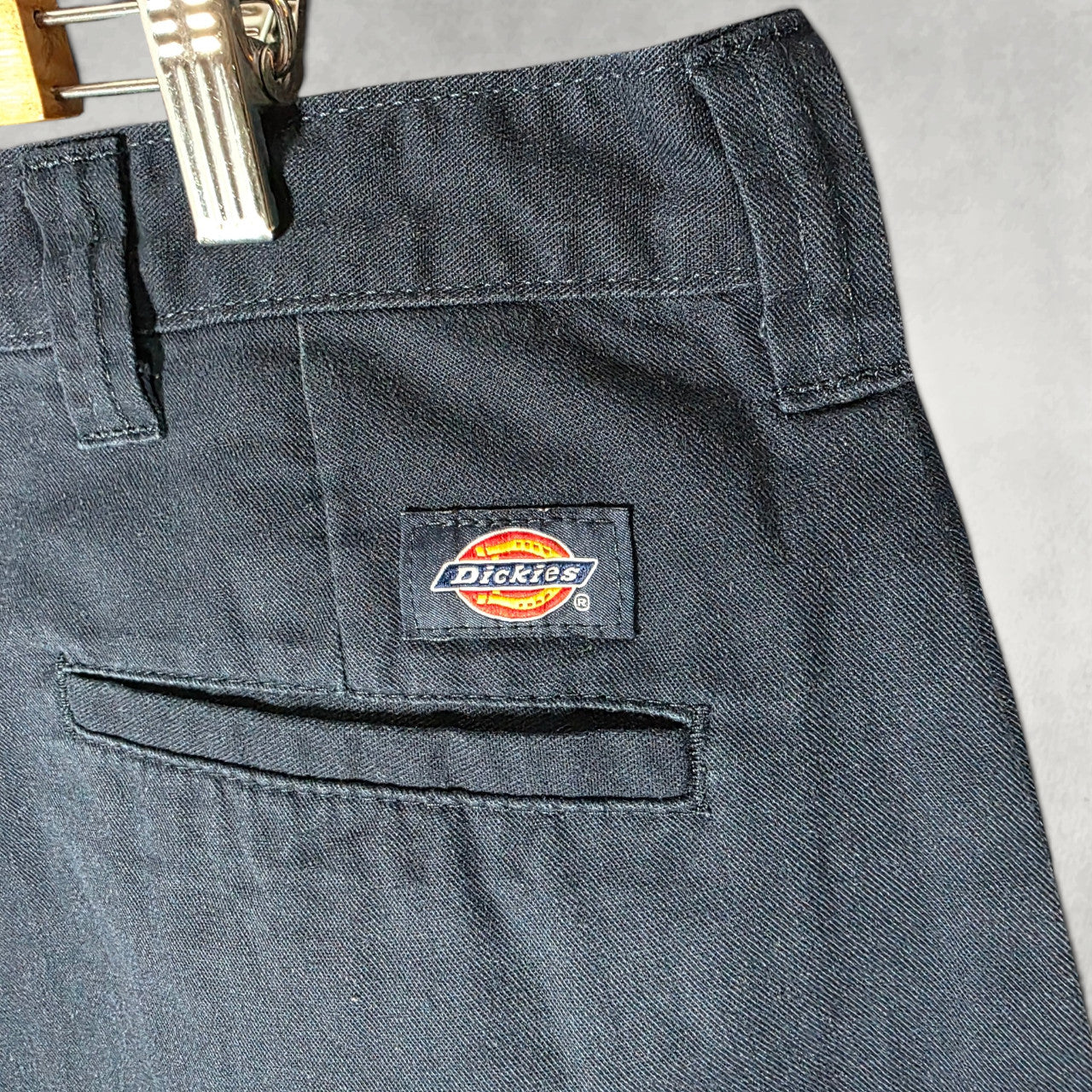 Dickies blue cargo trousers with zipped pockets and relaxed fit, made from durable flex fabric.