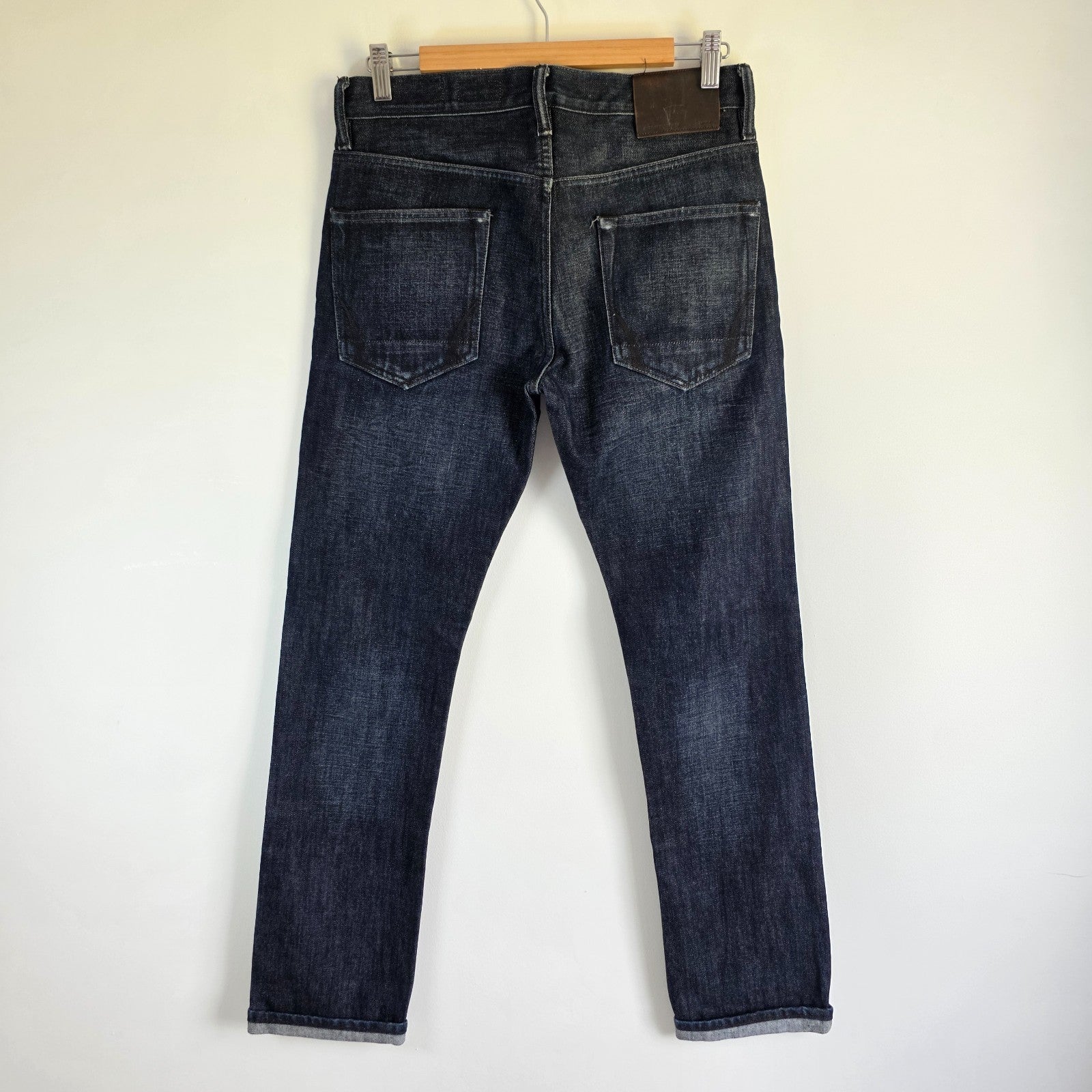 AllSaints blue straight jeans dark wash denim with subtle fading and slim fit.