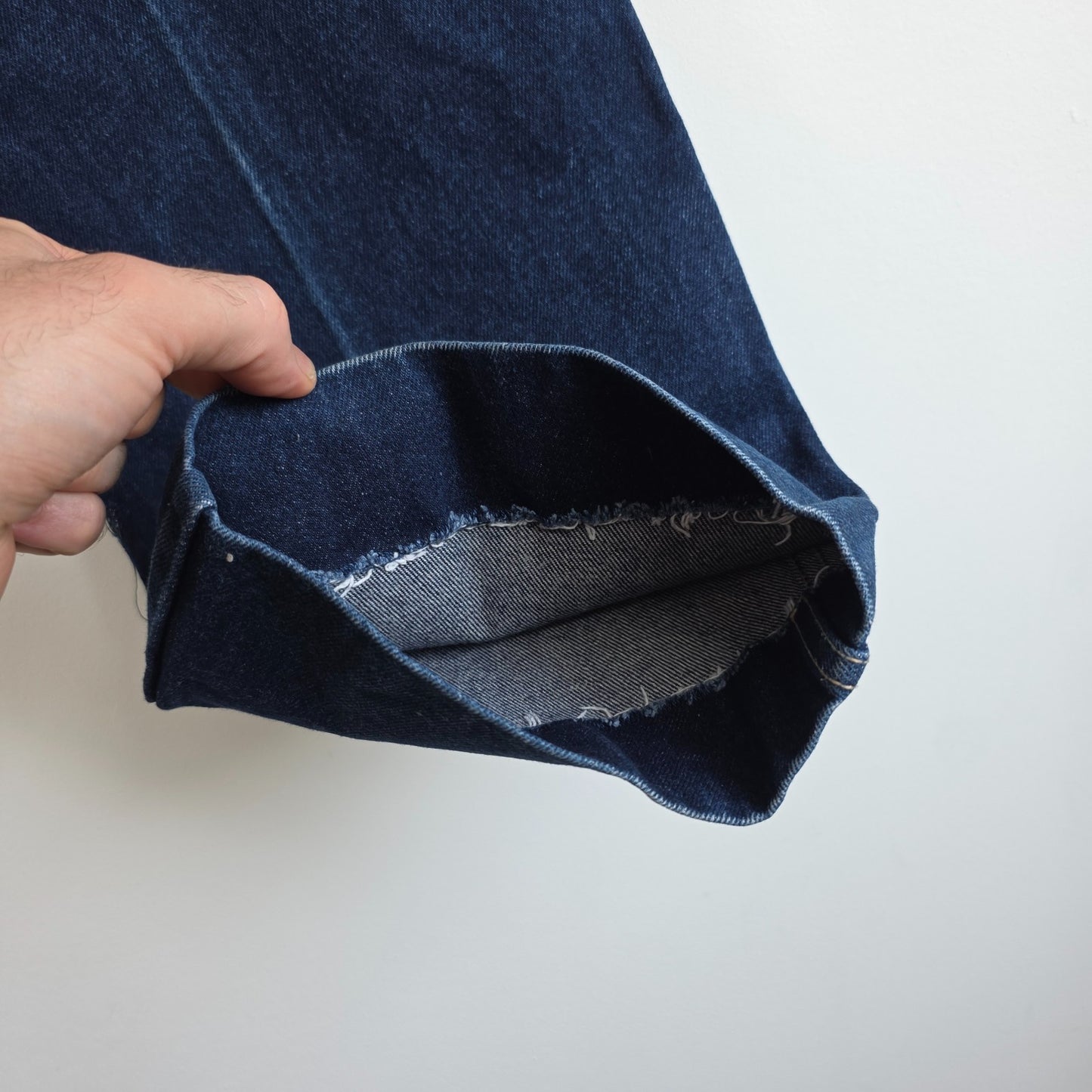 Calvin Klein blue straight leg jeans with vintage 90s style and cotton material.
