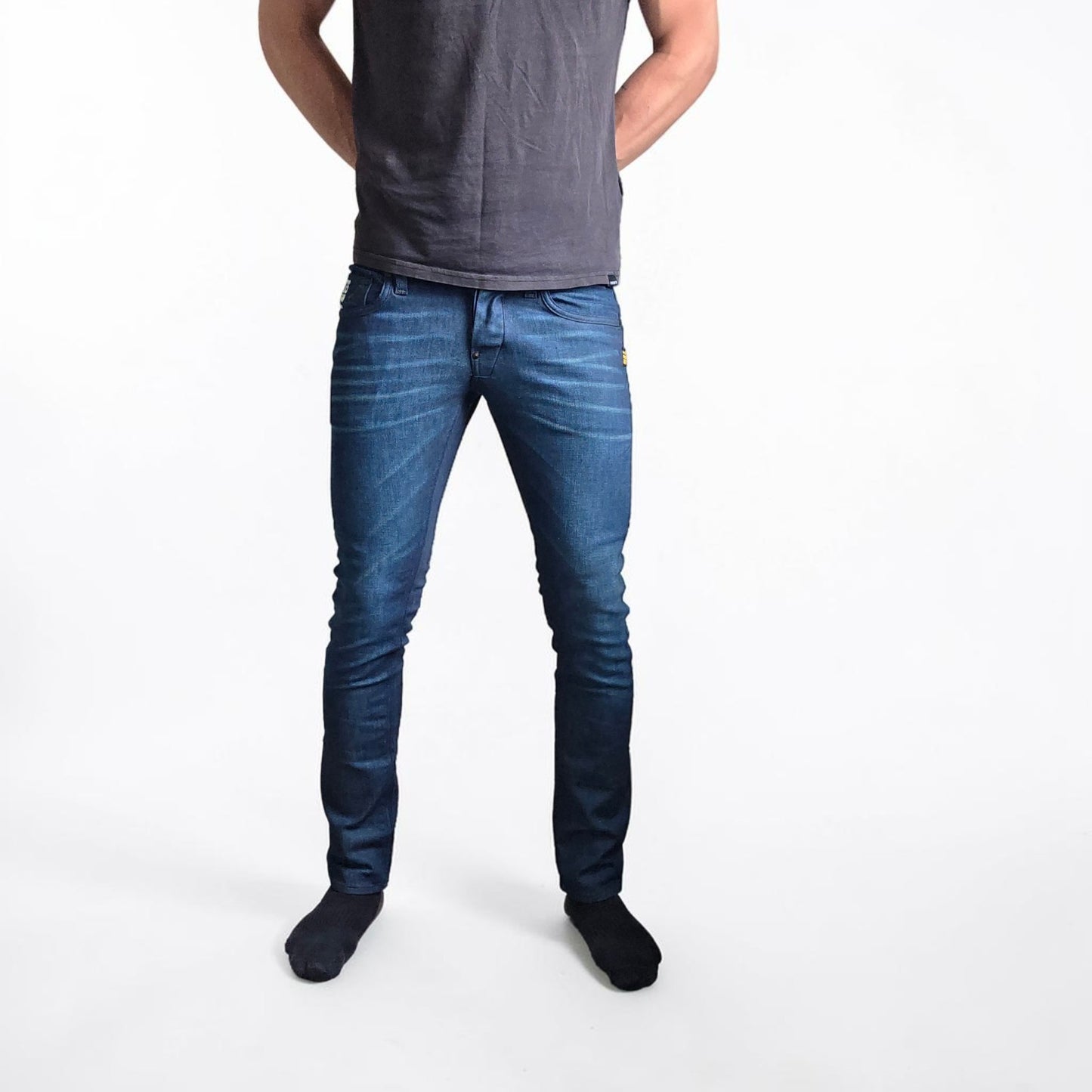 G-Star blue straight jeans with button fly and BNWT tag, cotton elastane blend.