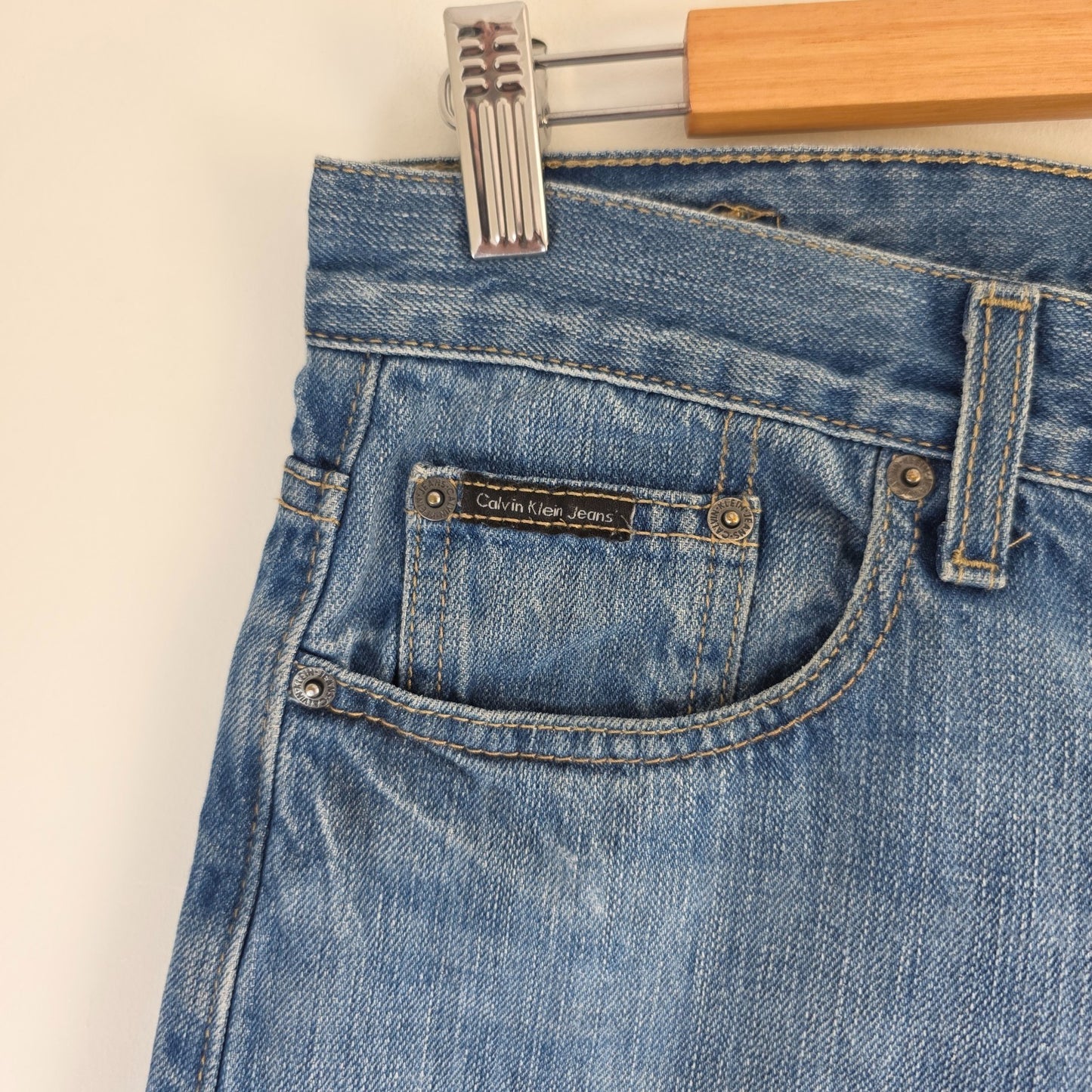 Calvin Klein blue straight jeans 100% cotton with relaxed fit and subtle logo detail.