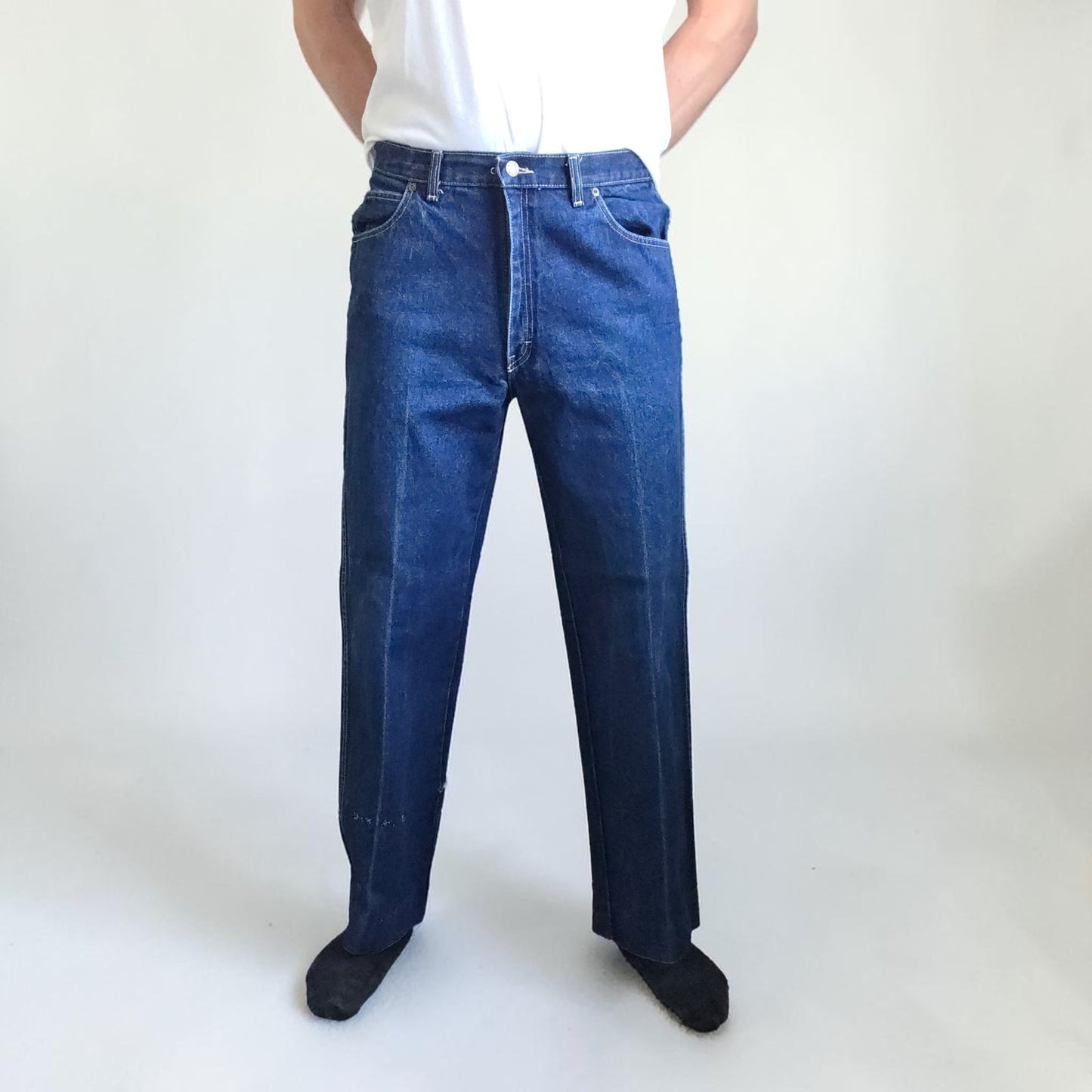 Calvin Klein blue straight leg jeans with vintage 90s style and cotton material.