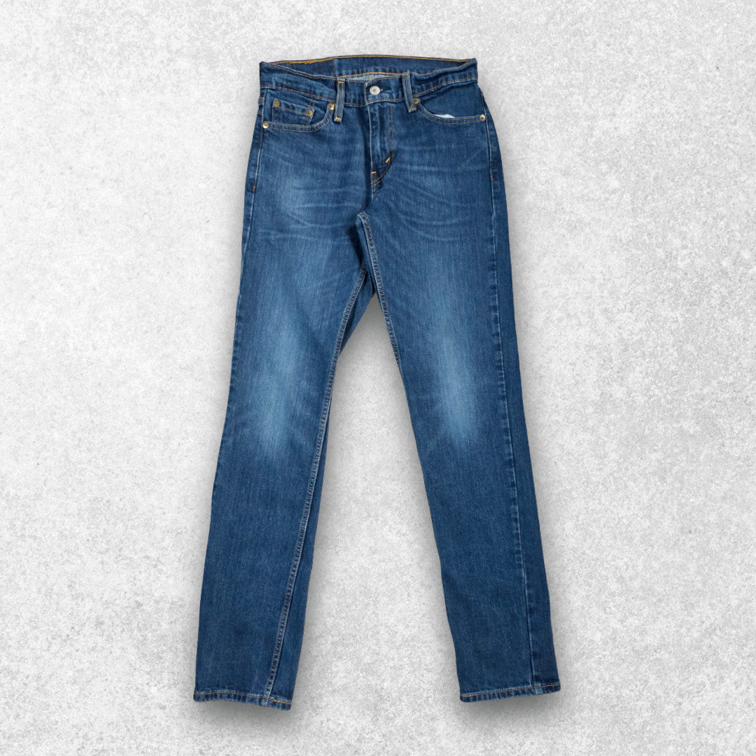 Levi's blue straight jeans with distressed patches and natural wear, made in USA.