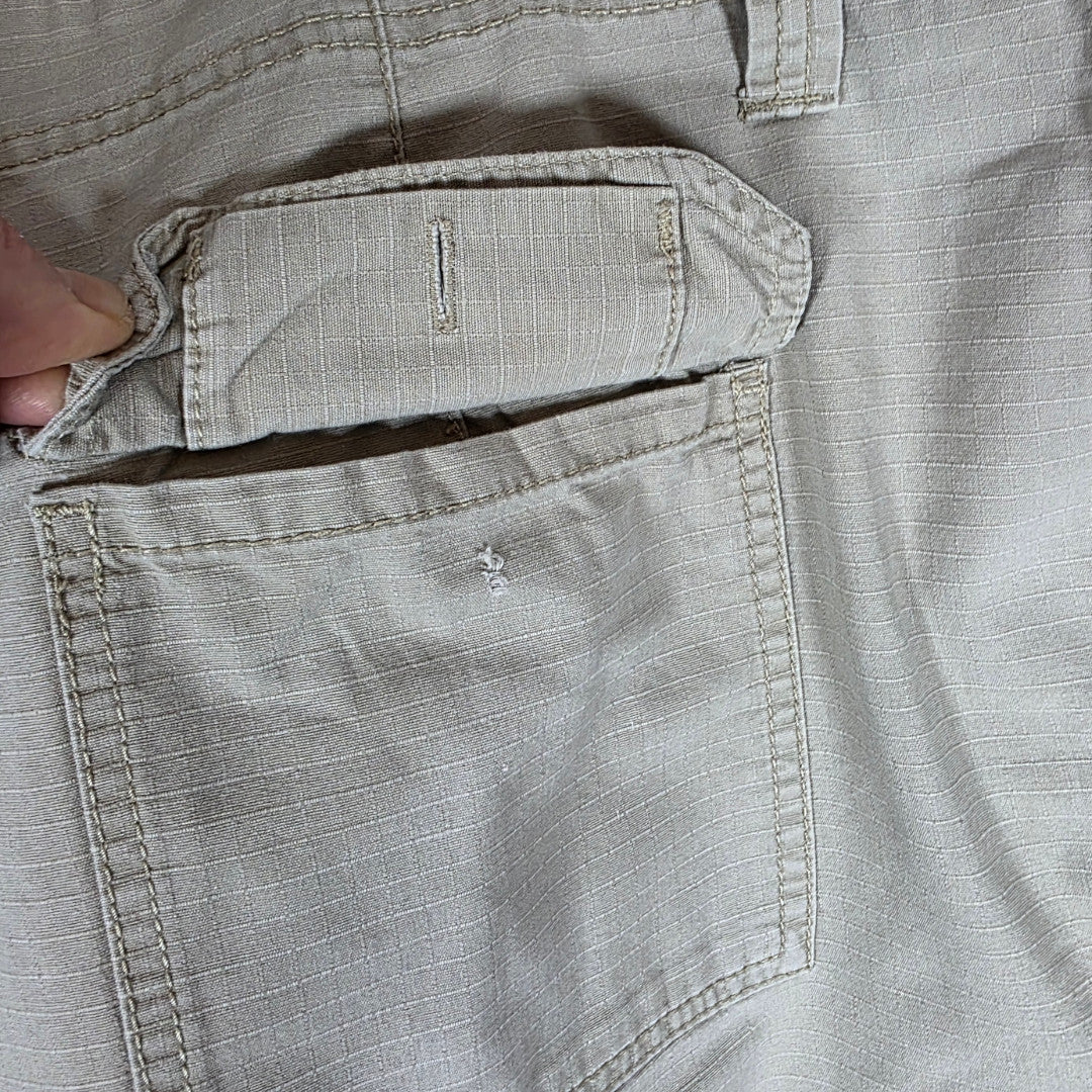 Polo Ralph Lauren beige cargo trousers with multiple pockets and straight leg cut.