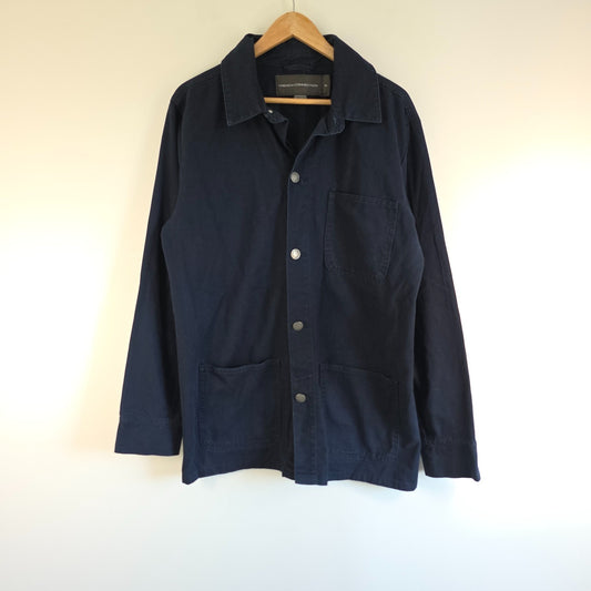 French Connection blue chore jacket with three patch pockets and metal button fastening.