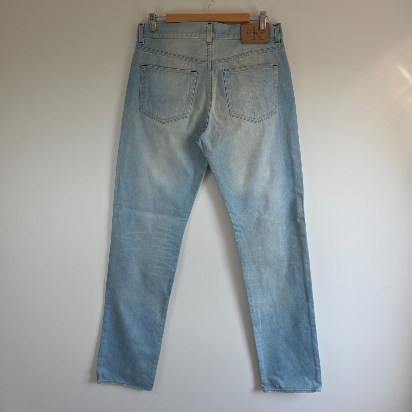 Calvin Klein light blue straight jeans, 100% cotton, classic five-pocket design.