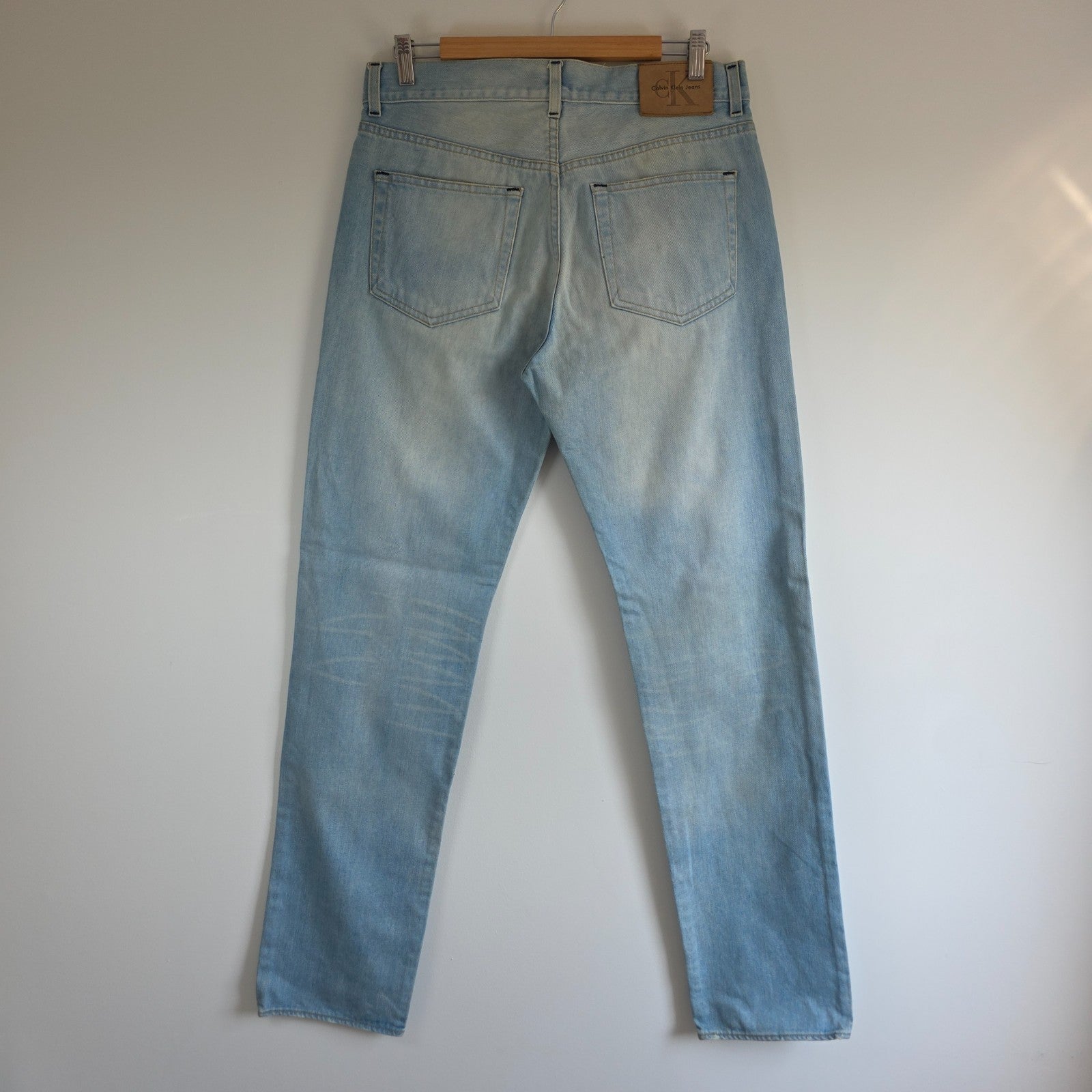 Calvin Klein light blue straight jeans, 100% cotton, classic five-pocket design.