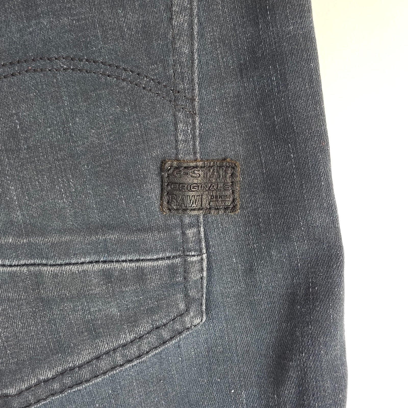 G-Star blue stretch denim slim jeans with biker detailing and logo patch.