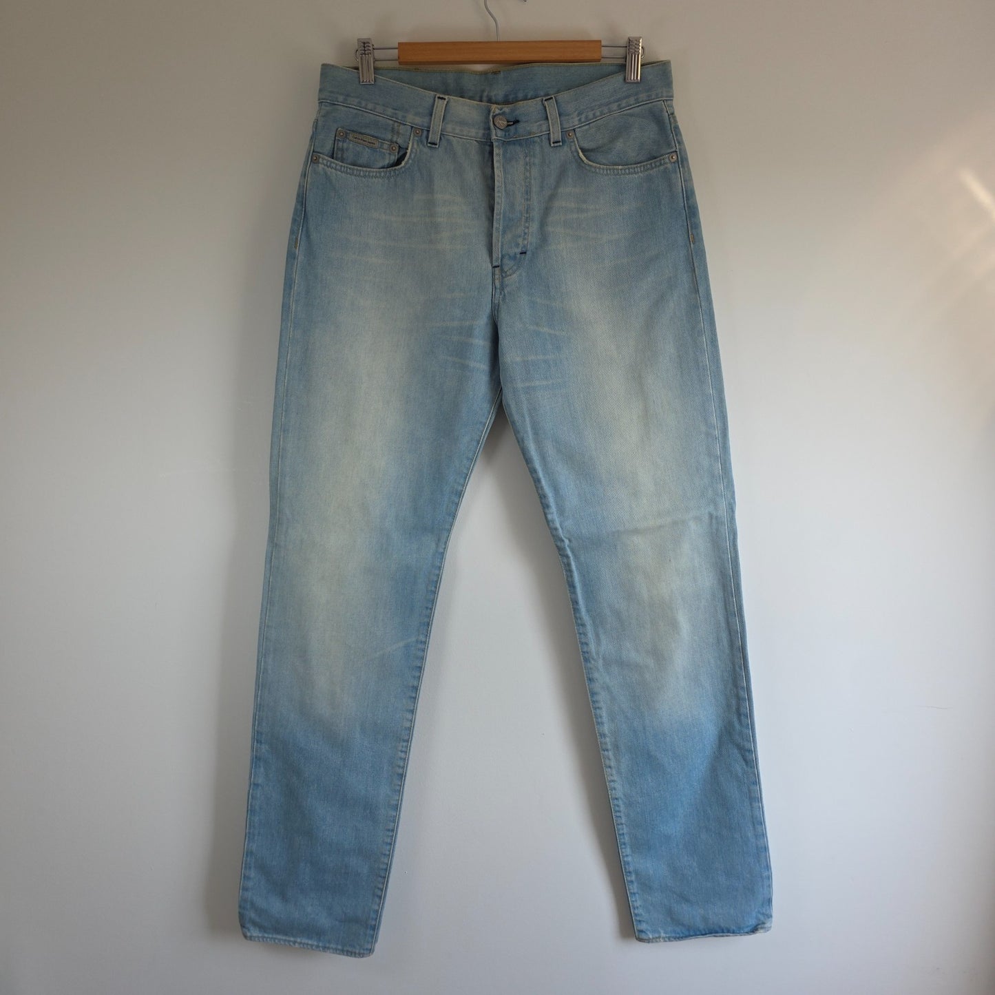 Calvin Klein light blue straight jeans, 100% cotton, classic five-pocket design.