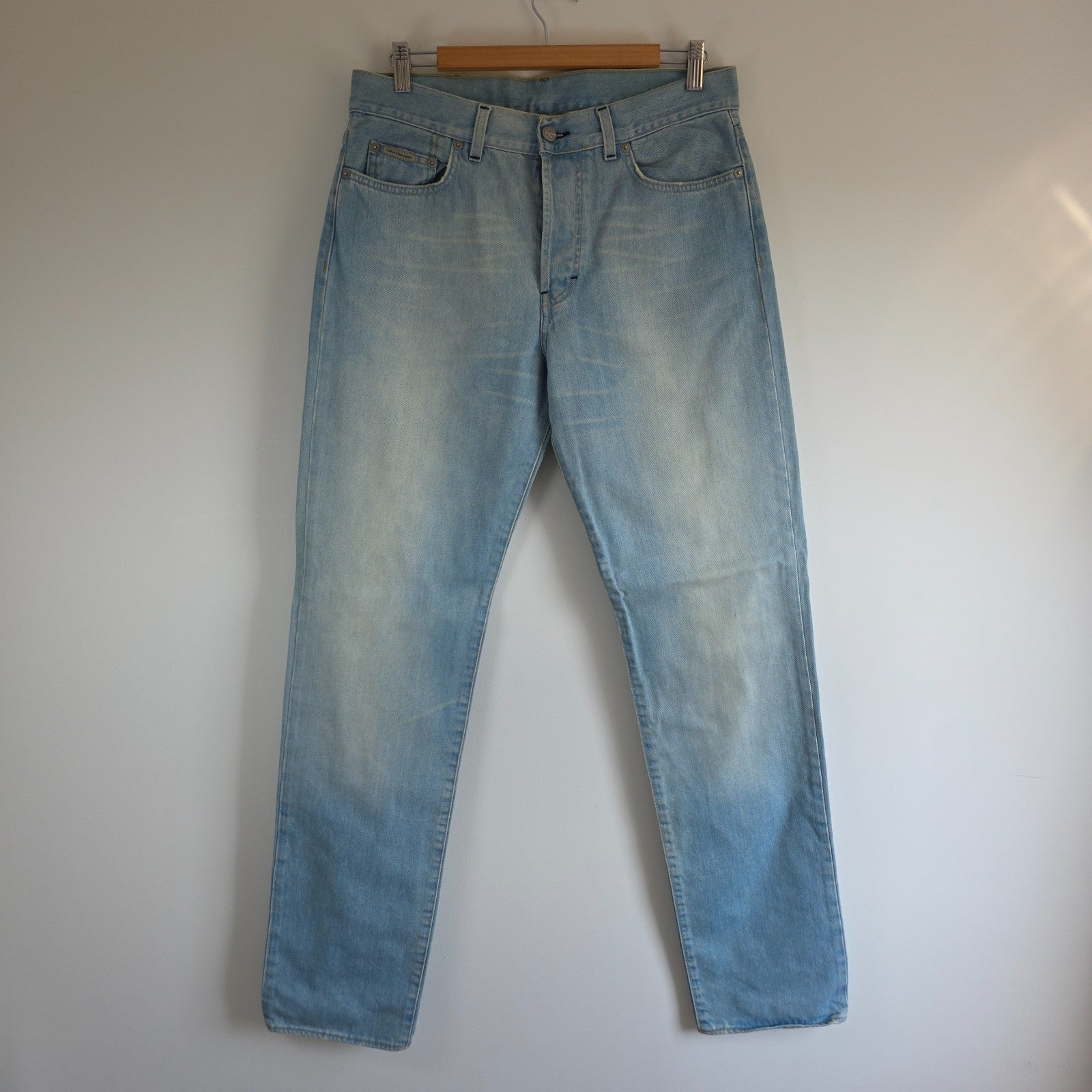Calvin Klein light blue straight jeans, 100% cotton, classic five-pocket design.