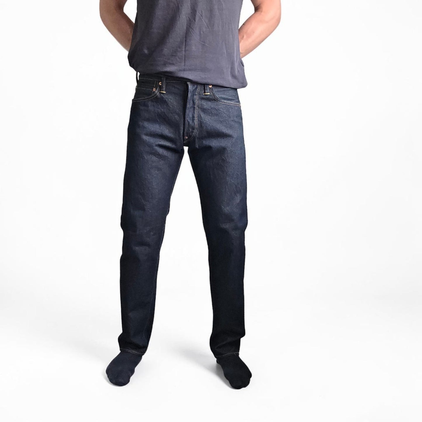Evisu blue straight jeans with selvedge denim and button fly detailing.