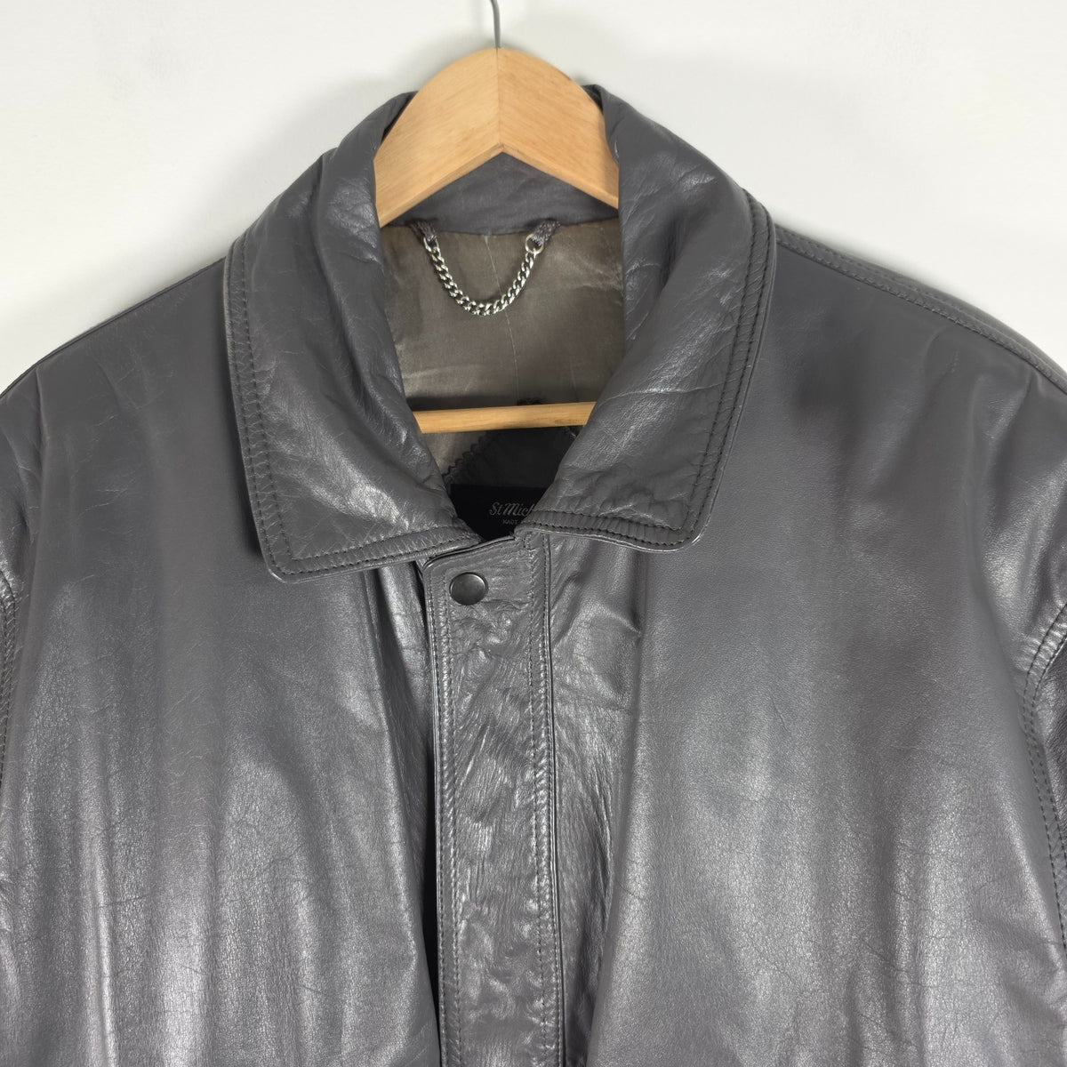St Michael grey leather bomber jacket with utility pockets and elasticated waistband.