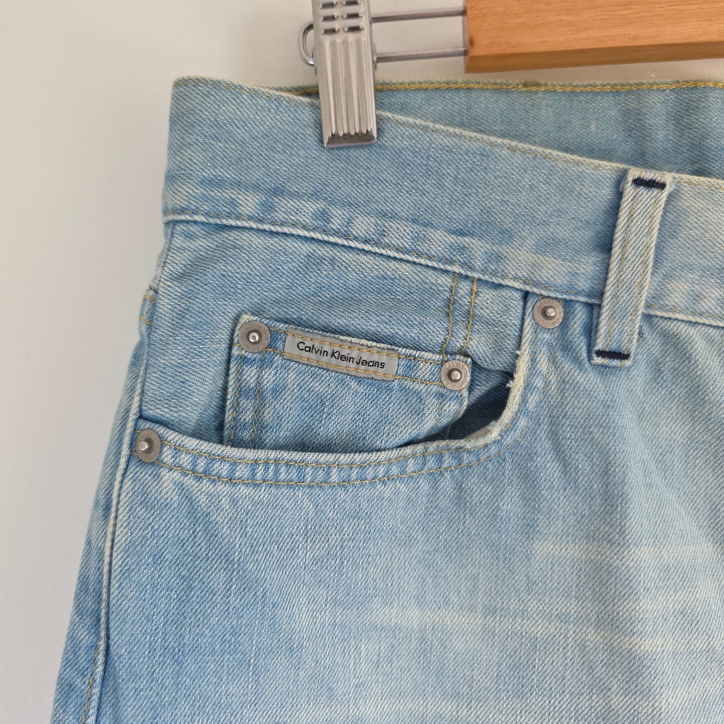 Calvin Klein light blue straight jeans, 100% cotton, classic five-pocket design.