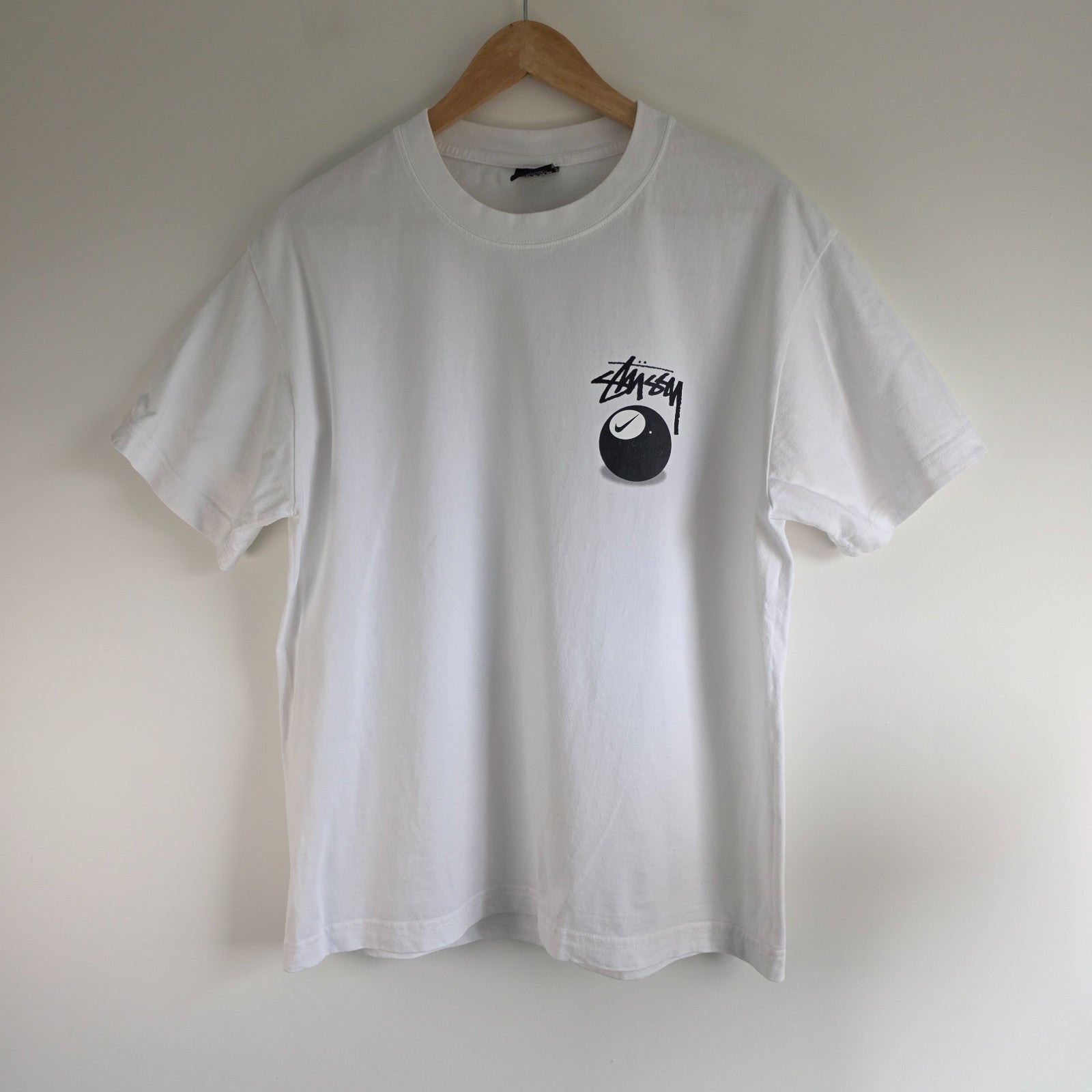 Stüssy x Nike white t-shirt with large 8 Ball back print and cotton material.