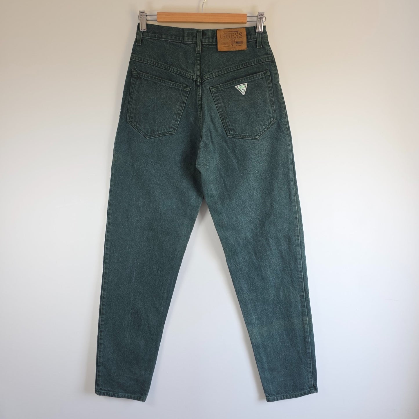 Levi's 501 white jeans distressed with natural wear, made in USA, classic fit.