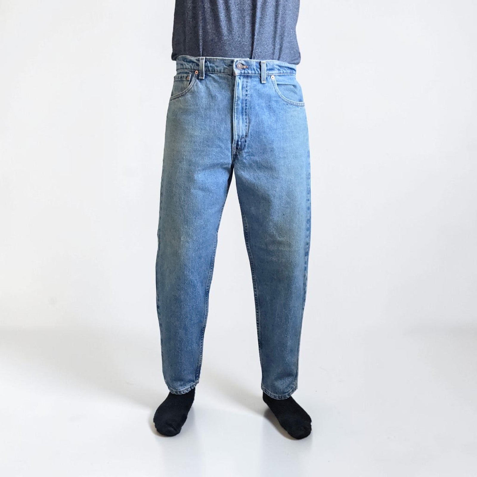 Levi's blue straight jeans vintage 550 relaxed fit with classic 90s silhouette.